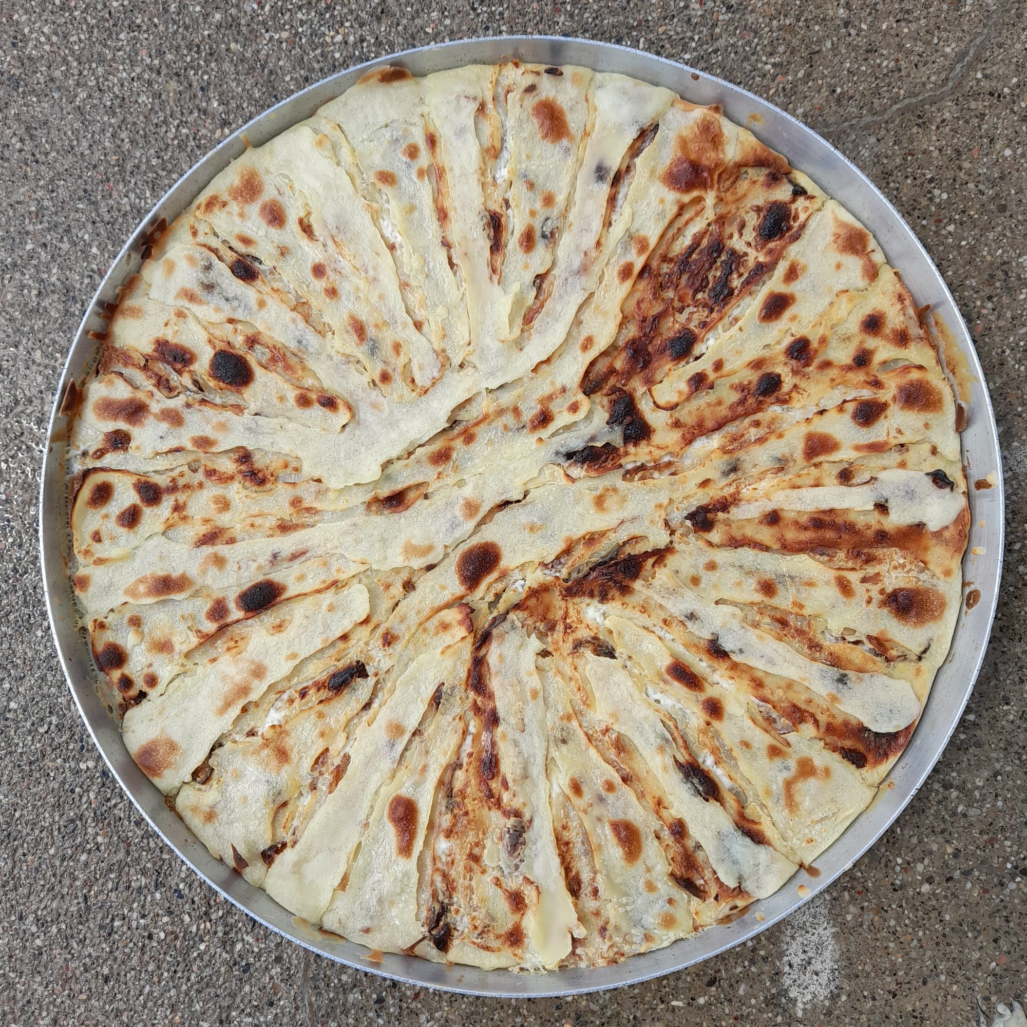 A tall, ringed pastry made of many thin layers