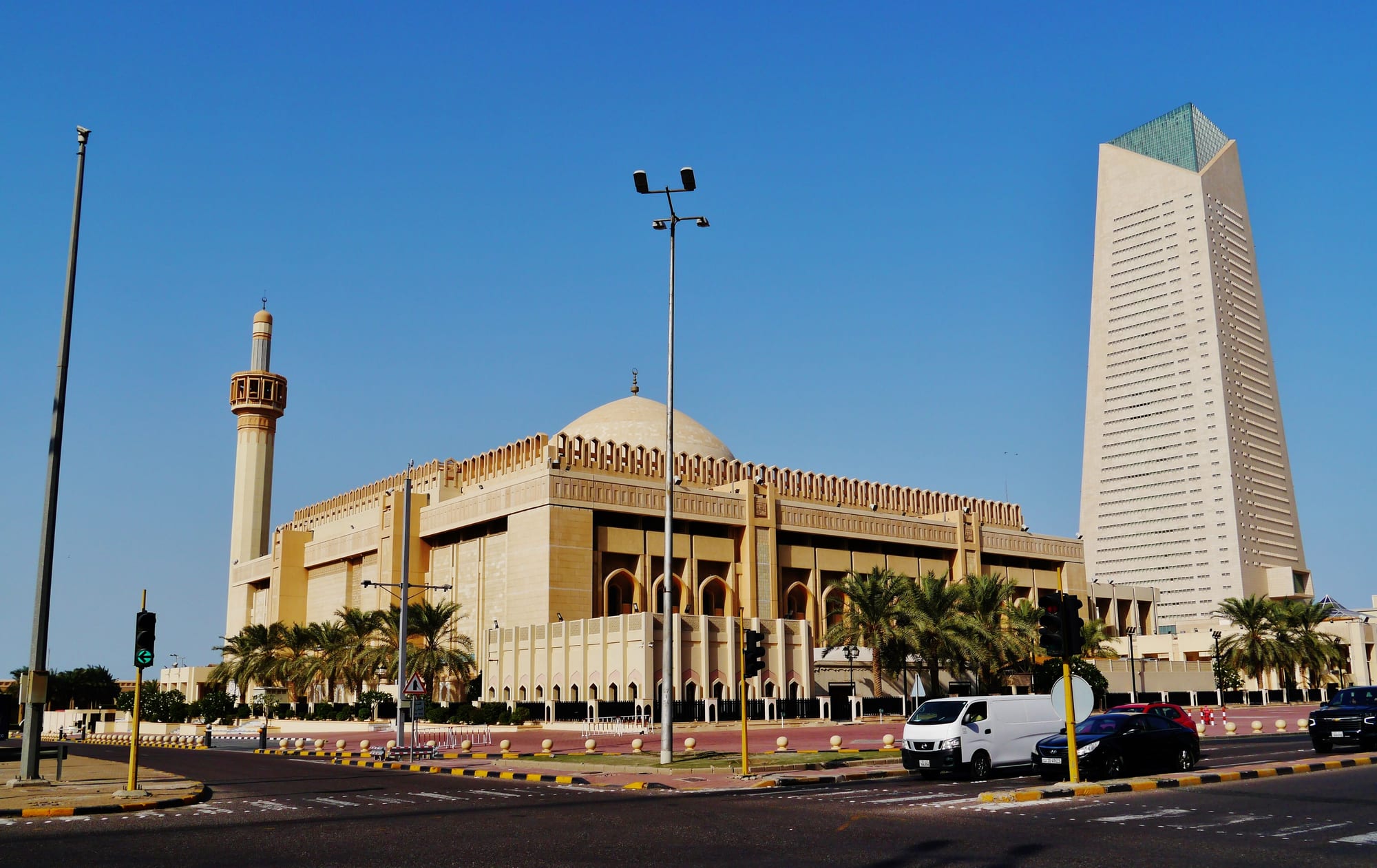 A large sandstone mosque with a big central dome and a single tall minaret