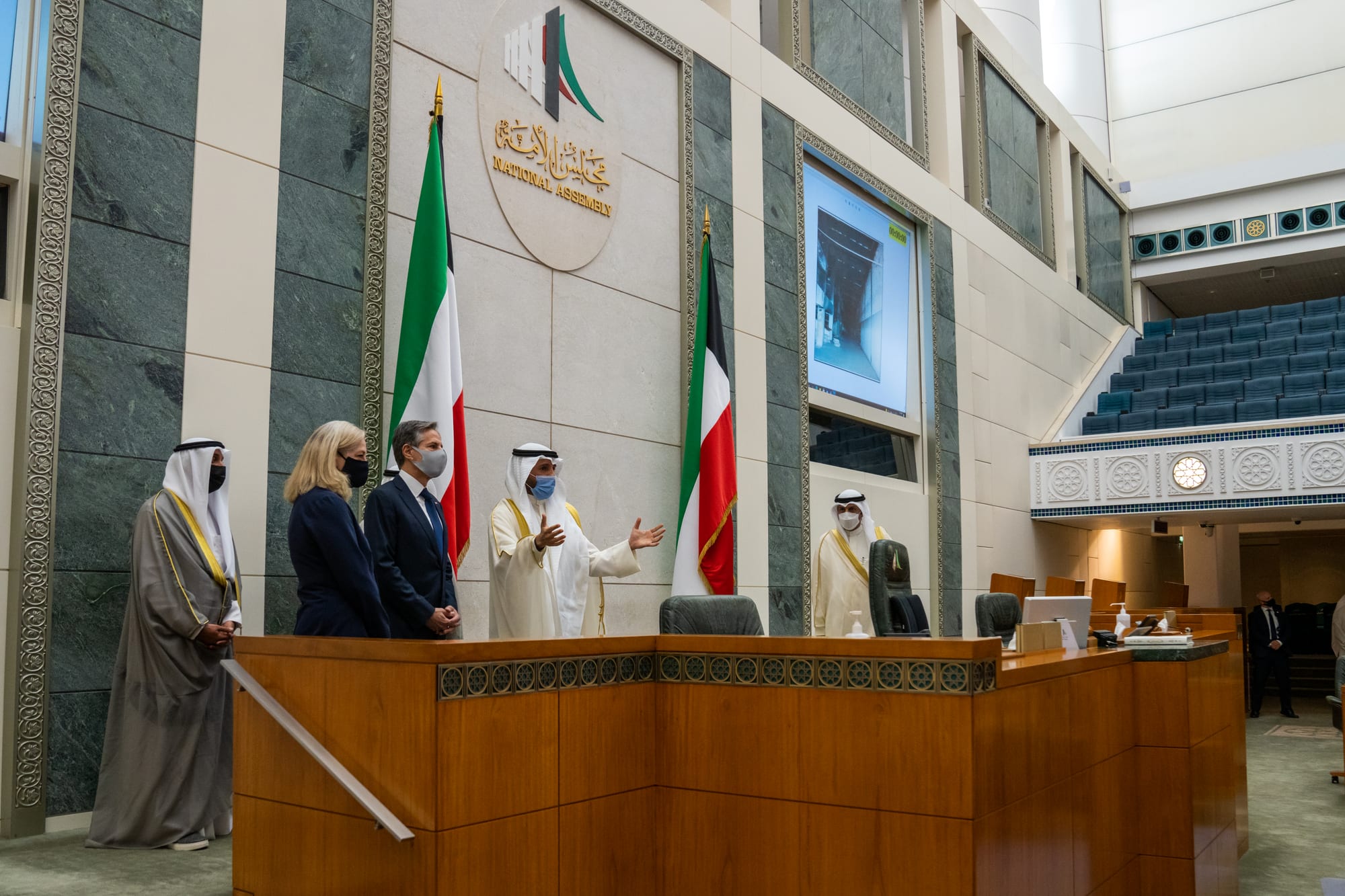 The tiered blue seats and speaker's rostrum of Kuwait's National Assembly chamber