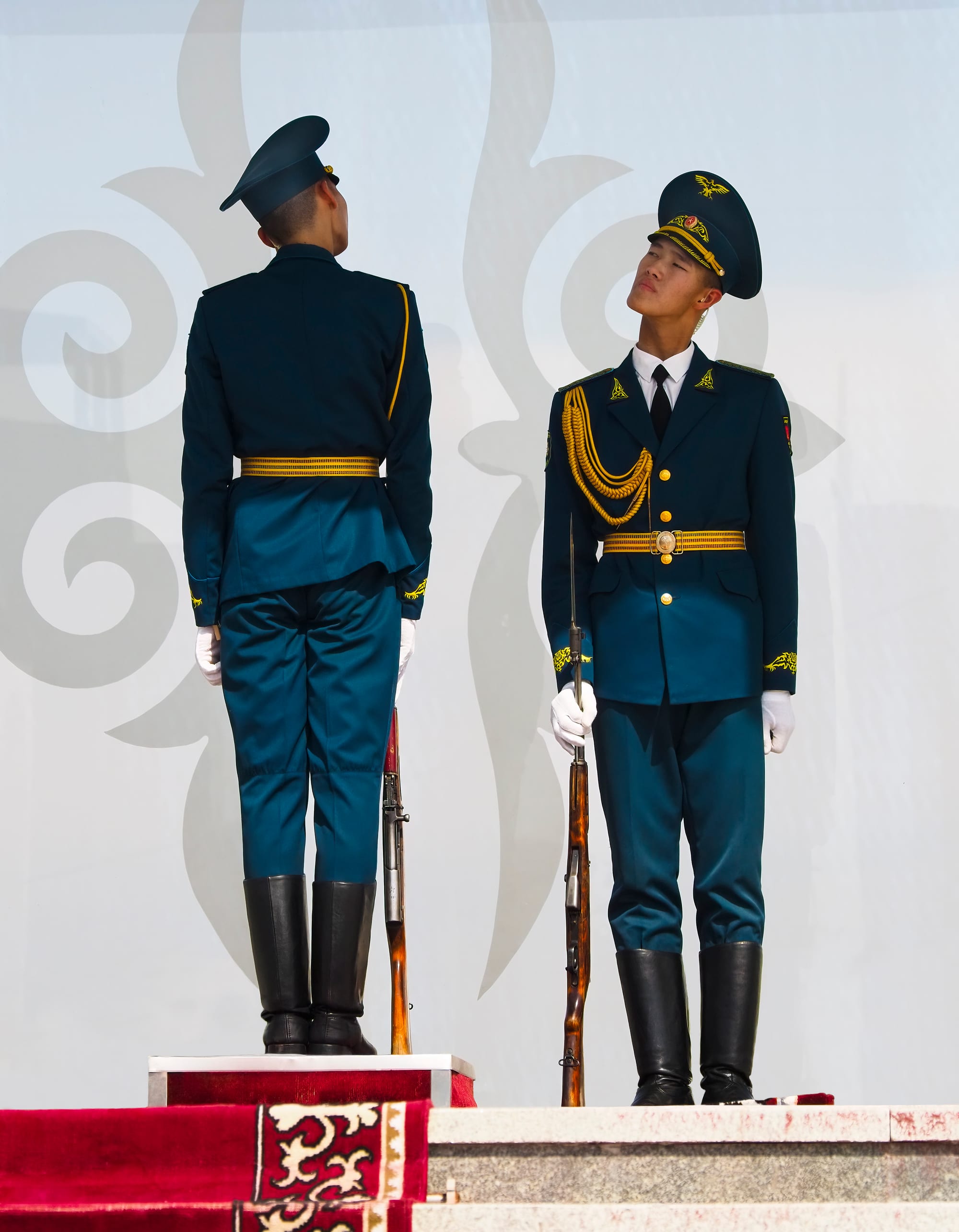 Ceremonial guards marching across the wide paved expanse of Ala-Too Square in Bishkek
