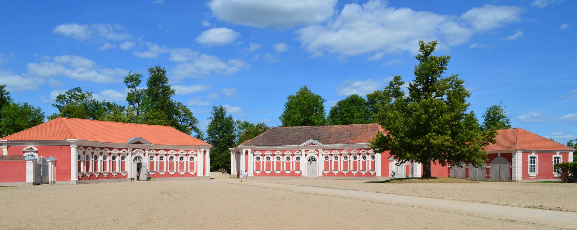 A long baroque palace of ochre and white with formal gardens, built for the Duke of Courland