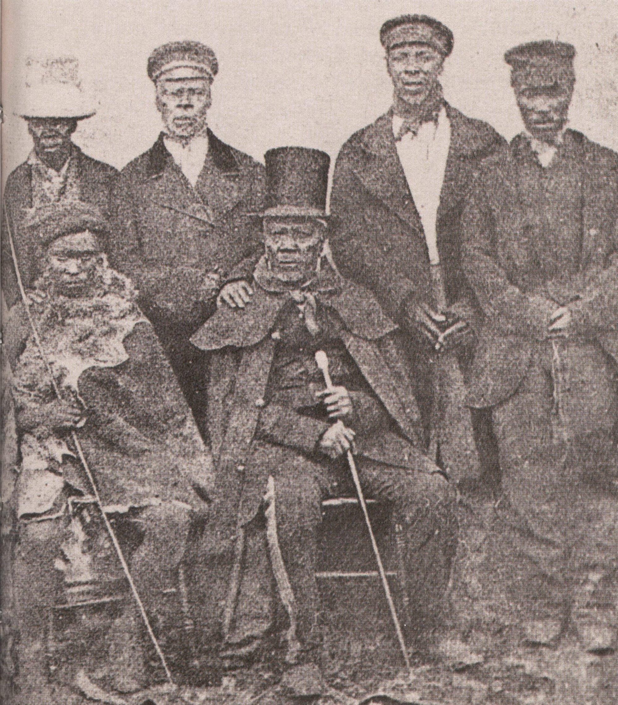 A 19th-century photograph of King Moshoeshoe seated with several of his advisers and sons