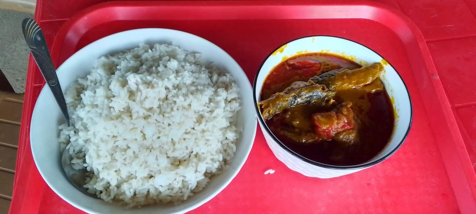 A bowl of thick, orange-red soup