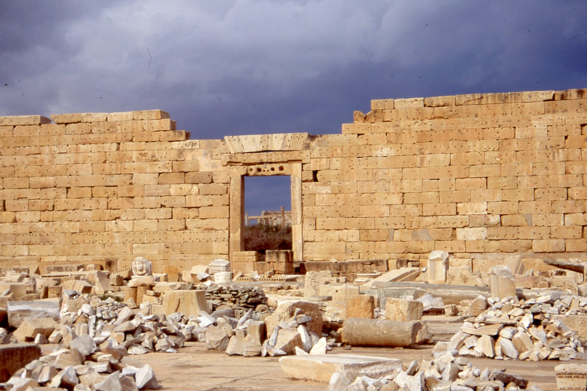 The columns, arches and paved forum of a large Roman city near the Libyan coast