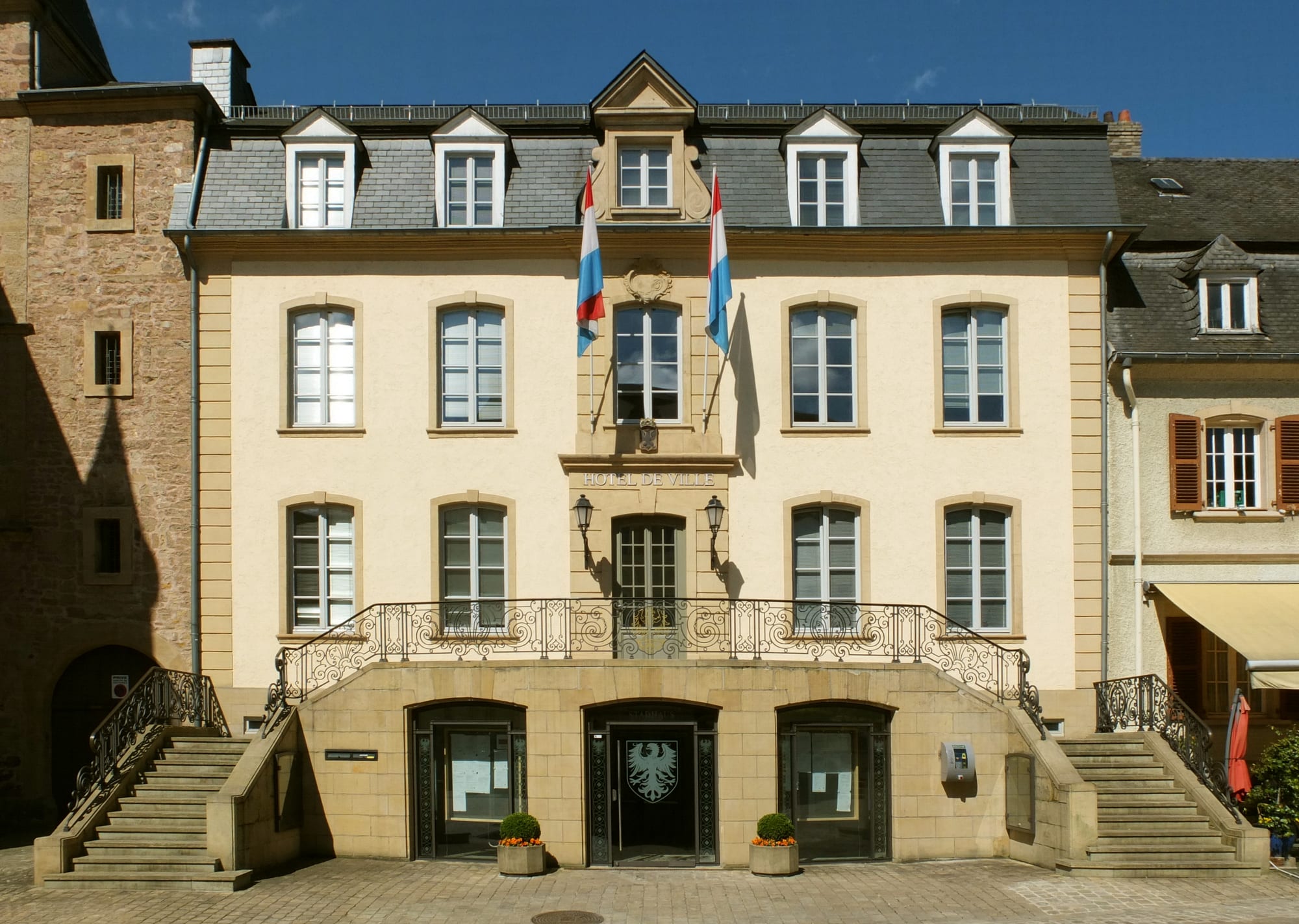 A historic town hall and market square with medieval and Renaissance buildings