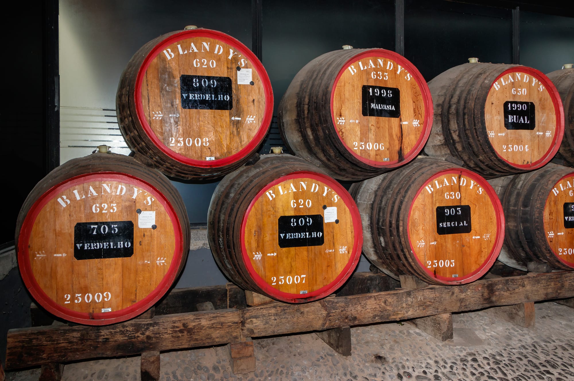 The wooden balconied courtyard of a historic Madeira wine lodge in Funchal