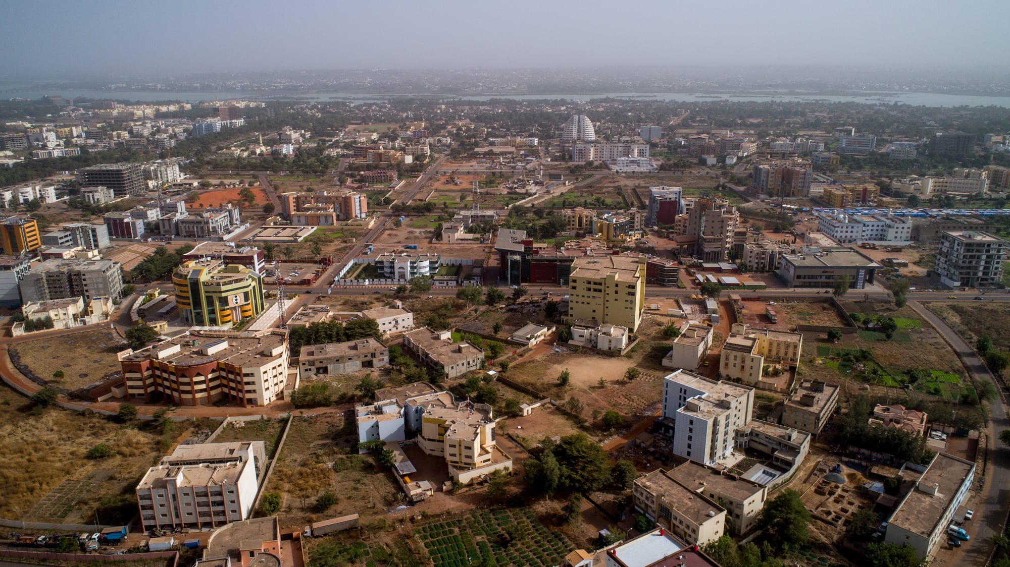 A sprawling city along a wide river, seen from above