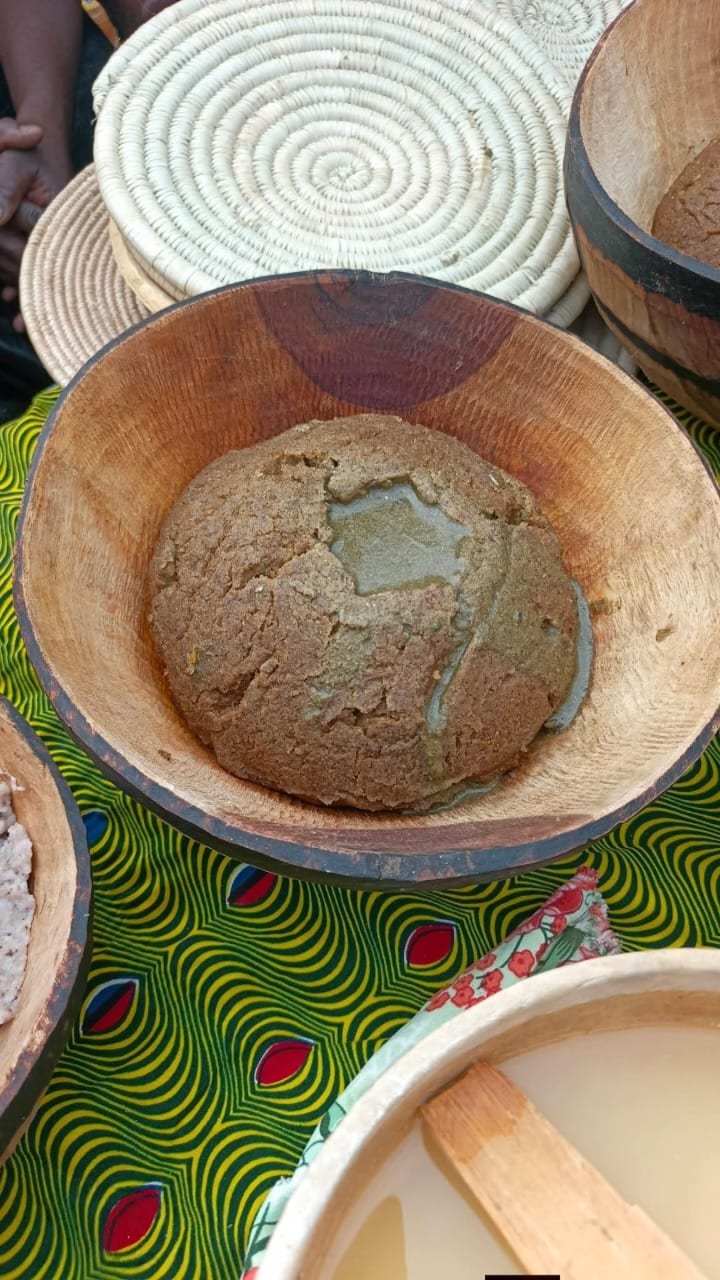 A thick, pale millet paste served in a bowl