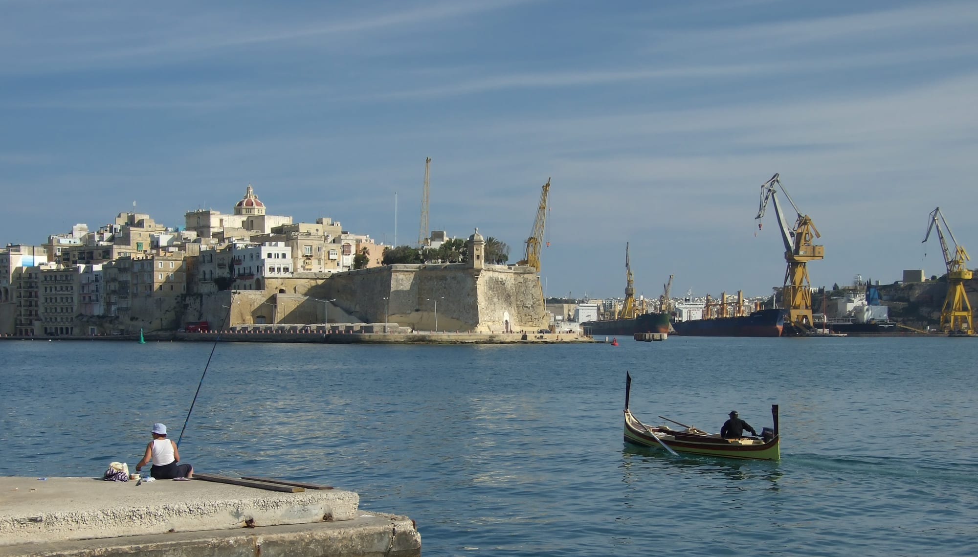 A fortified honey-coloured city on a peninsula surrounded by a deep natural harbour