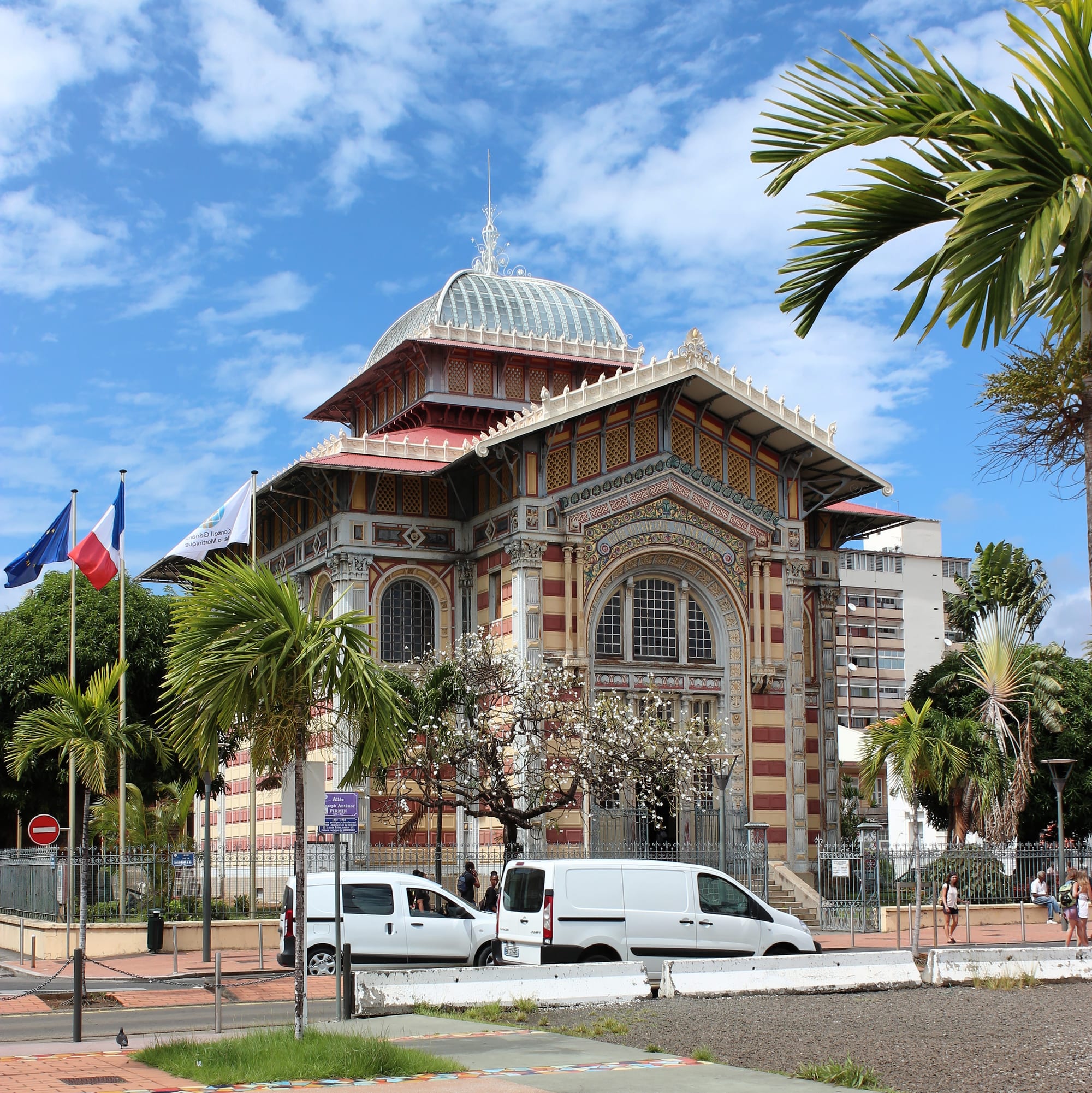 An ornate Byzantine-Romanesque style library building with a colourful domed roof