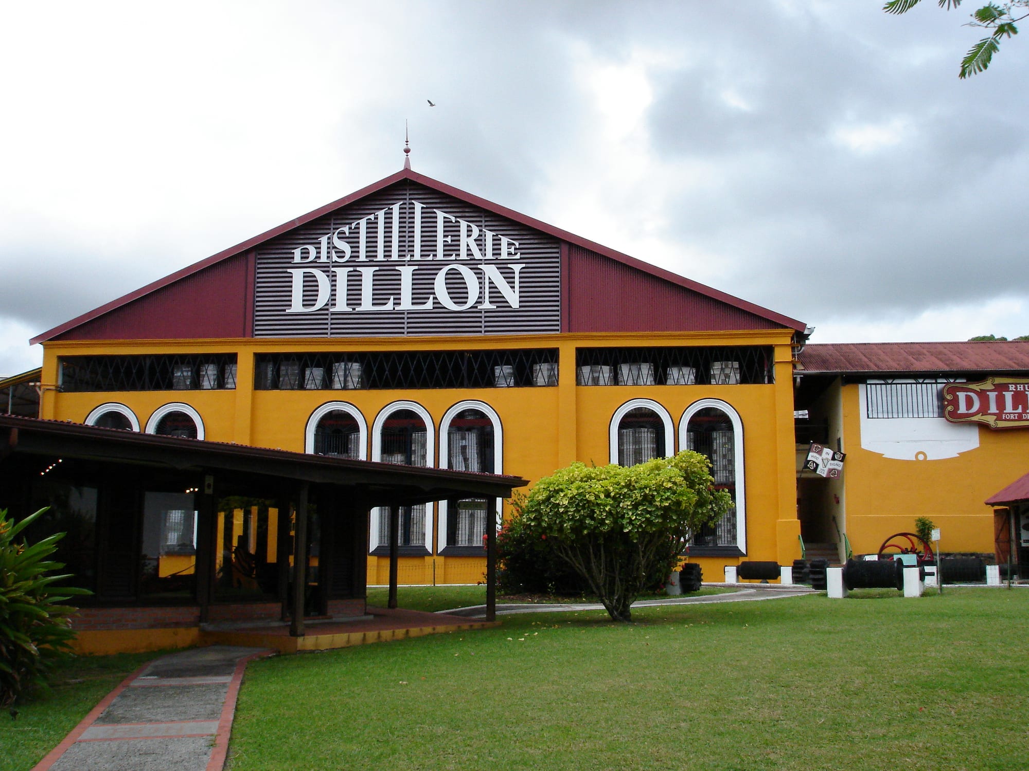 Copper stills and industrial buildings of a rum distillery in Martinique