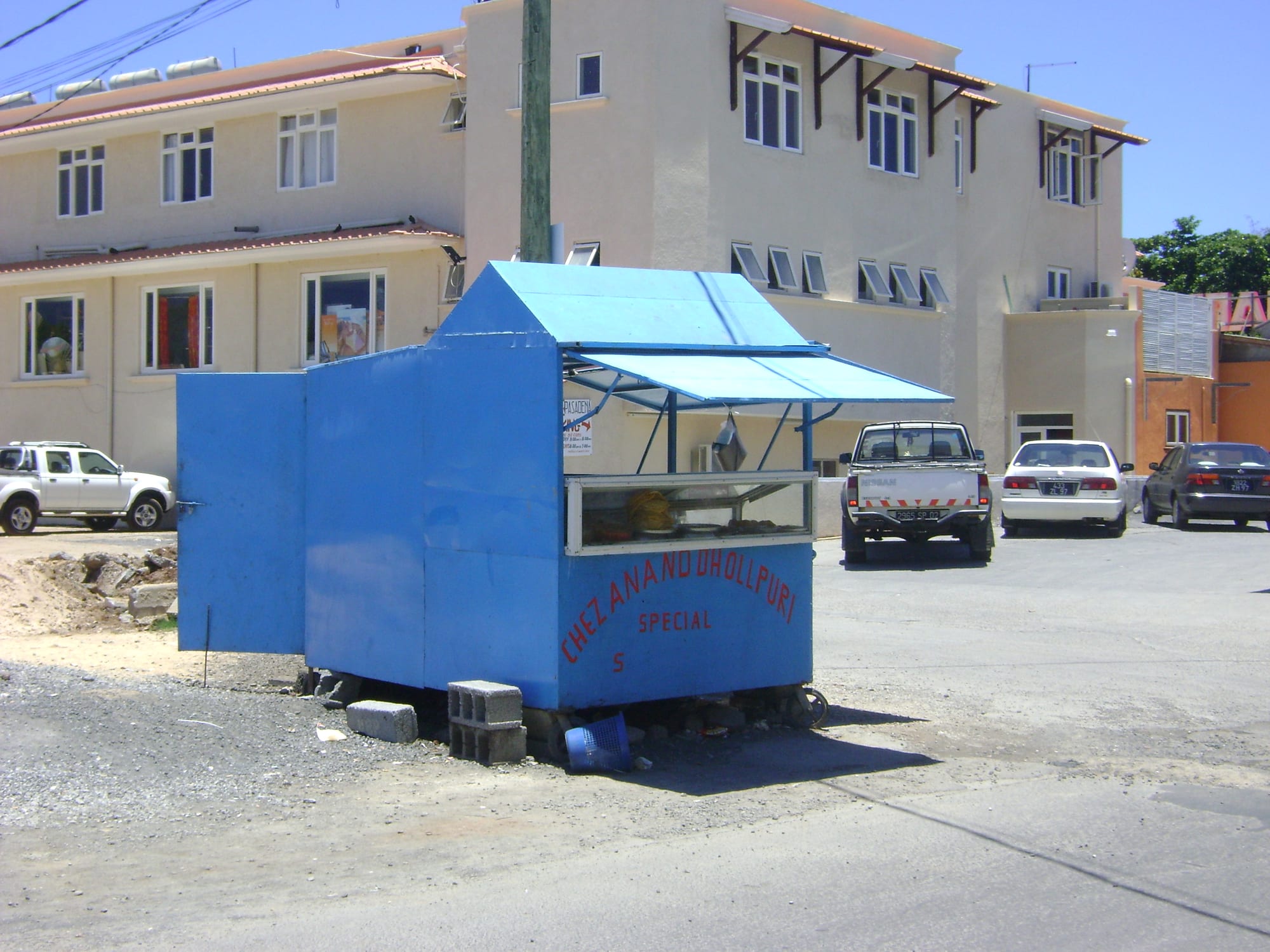A street vendor preparing food at an outdoor stall
