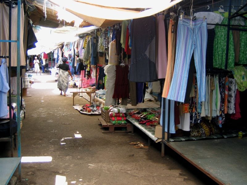 A roadside market with vendors and produce