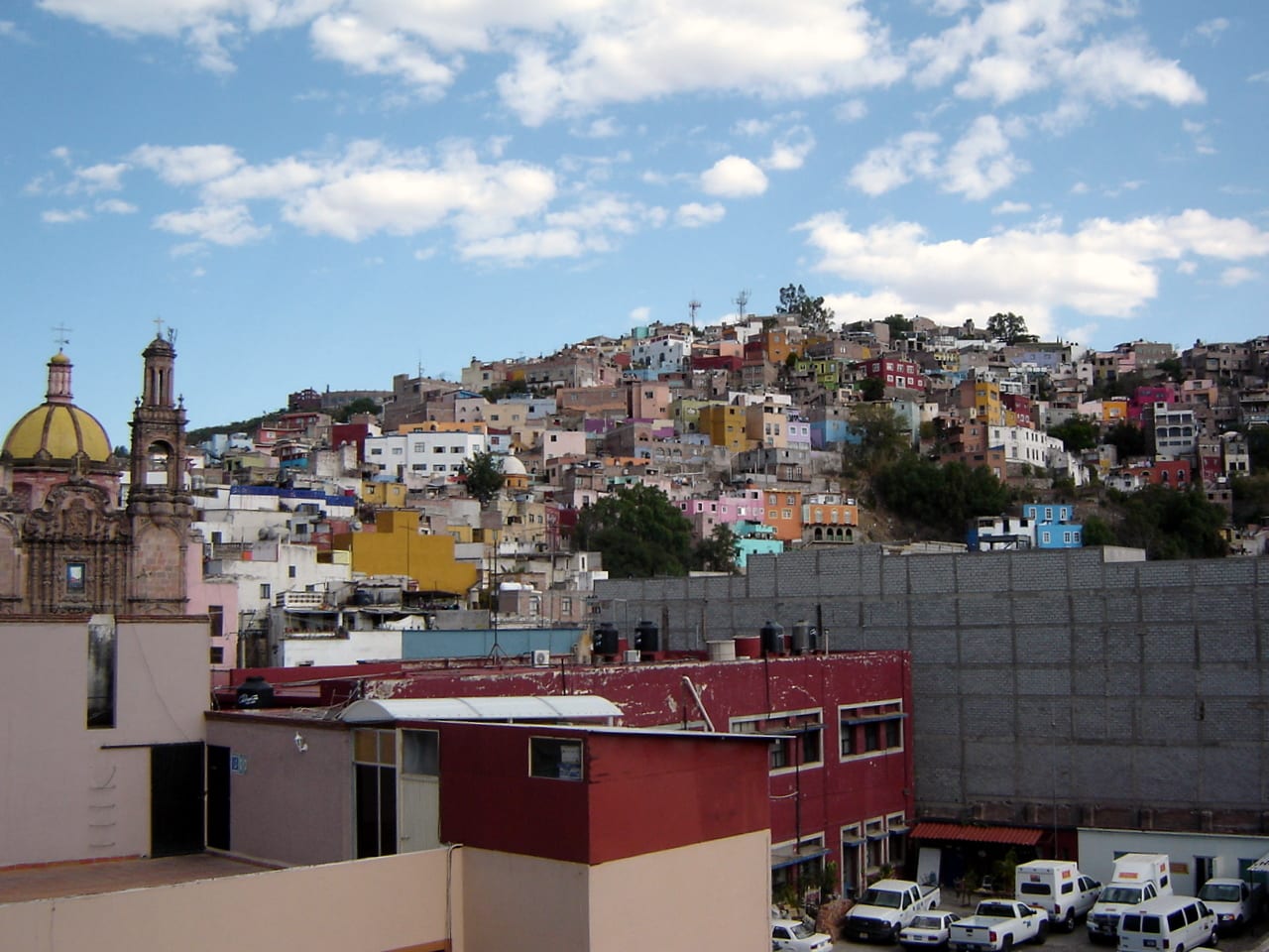 Brightly coloured houses stacked densely on steep hillsides