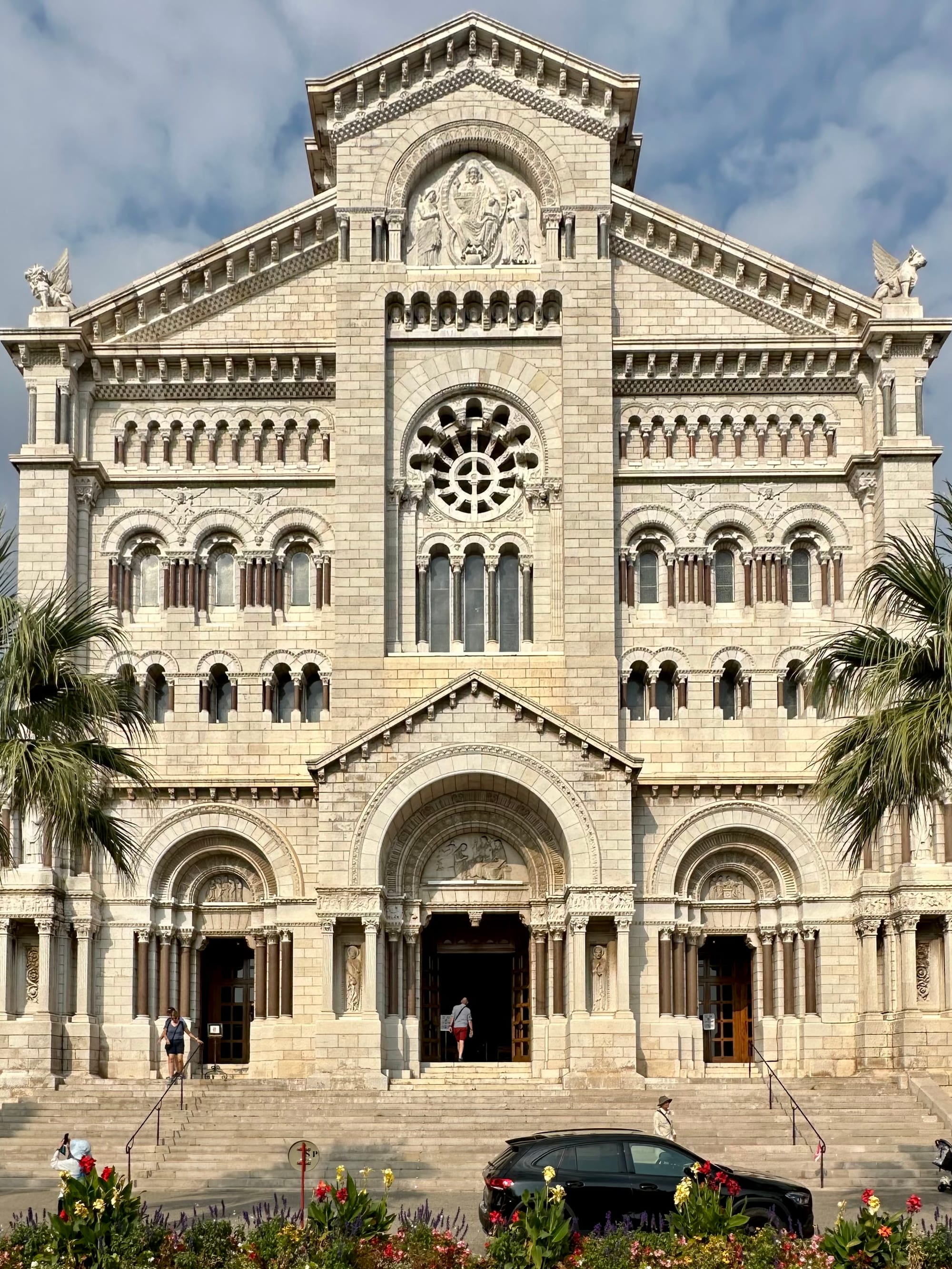 A white Romanesque-Byzantine cathedral with a square bell tower