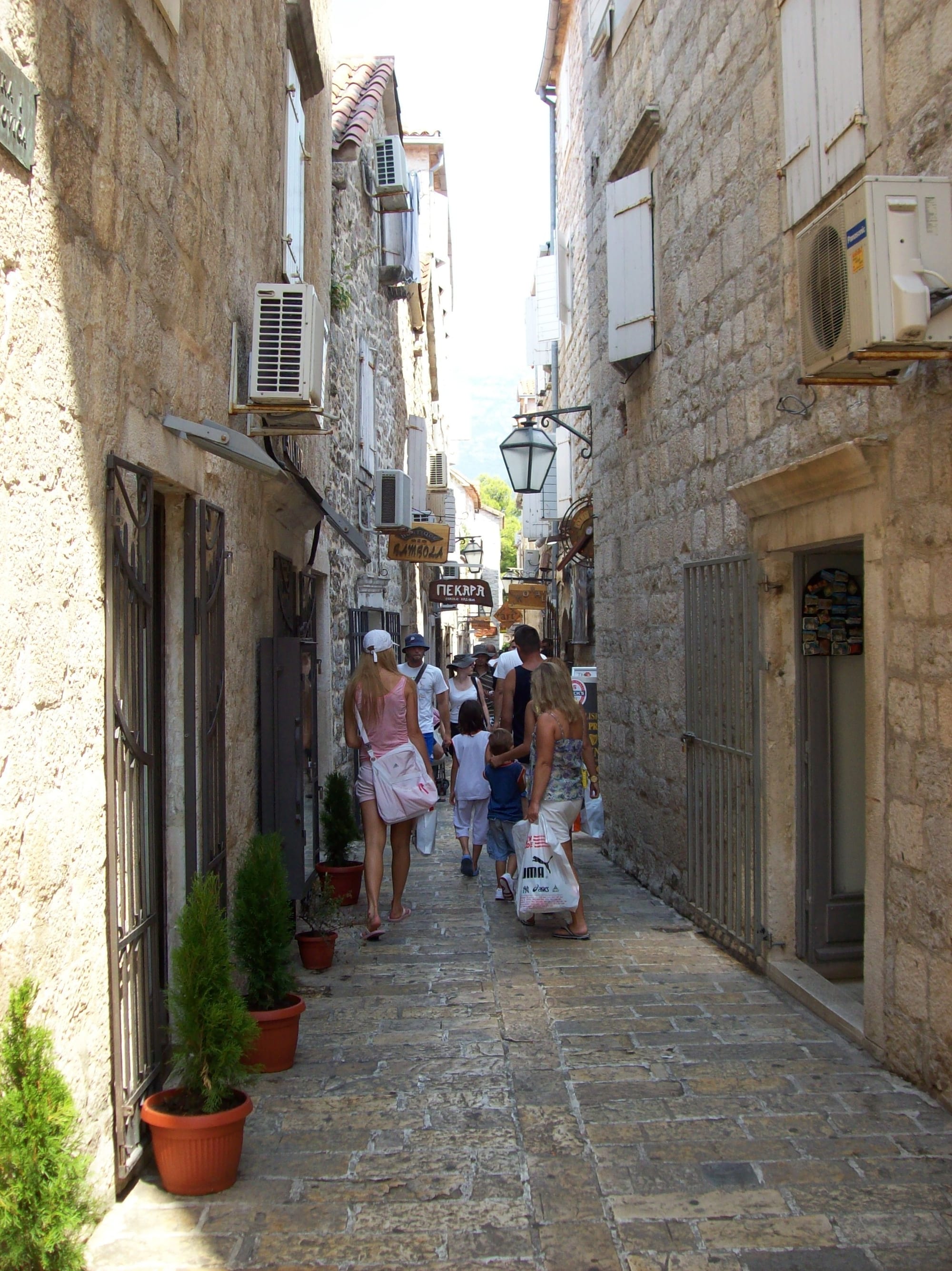 Narrow stone streets and old buildings inside a walled medieval coastal town