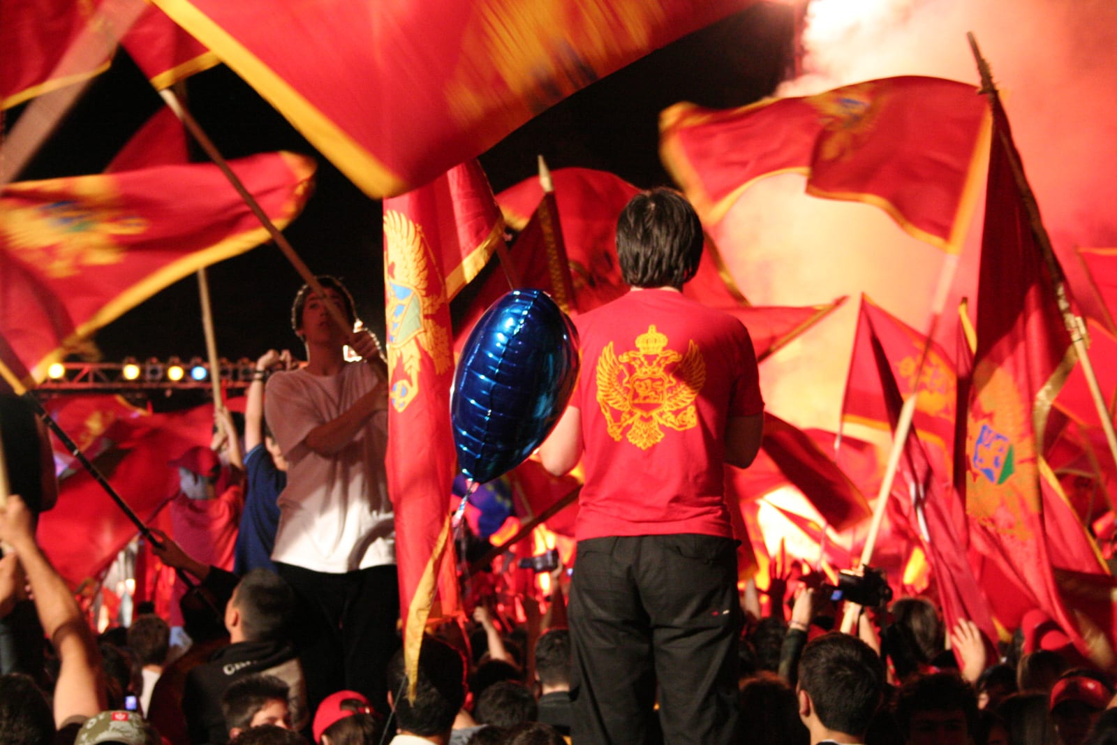 A crowd celebrating with Montenegrin flags in the streets after the 2006 referendum