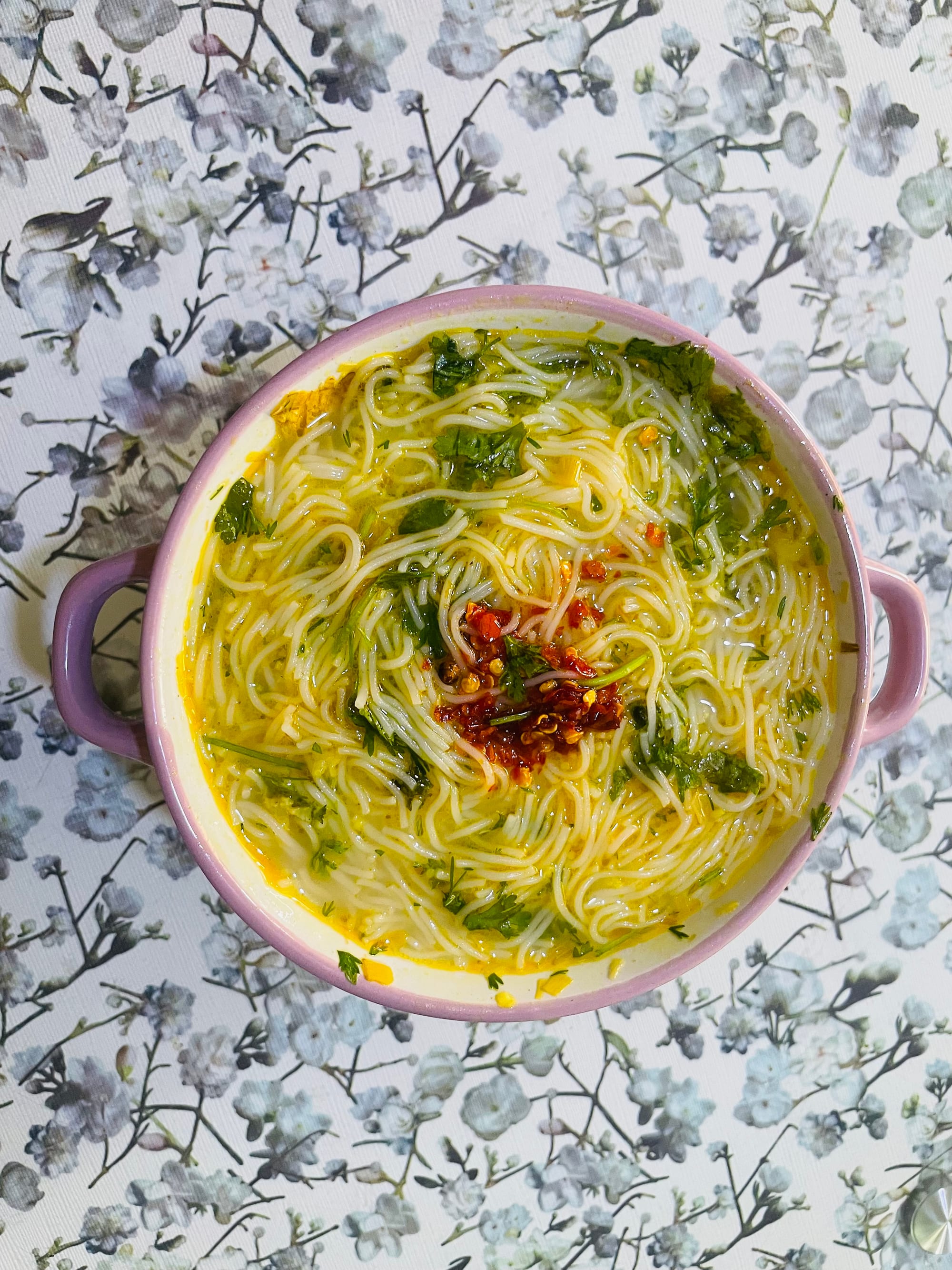 A bowl of rice noodle soup in a savoury fish broth, Myanmar's national dish