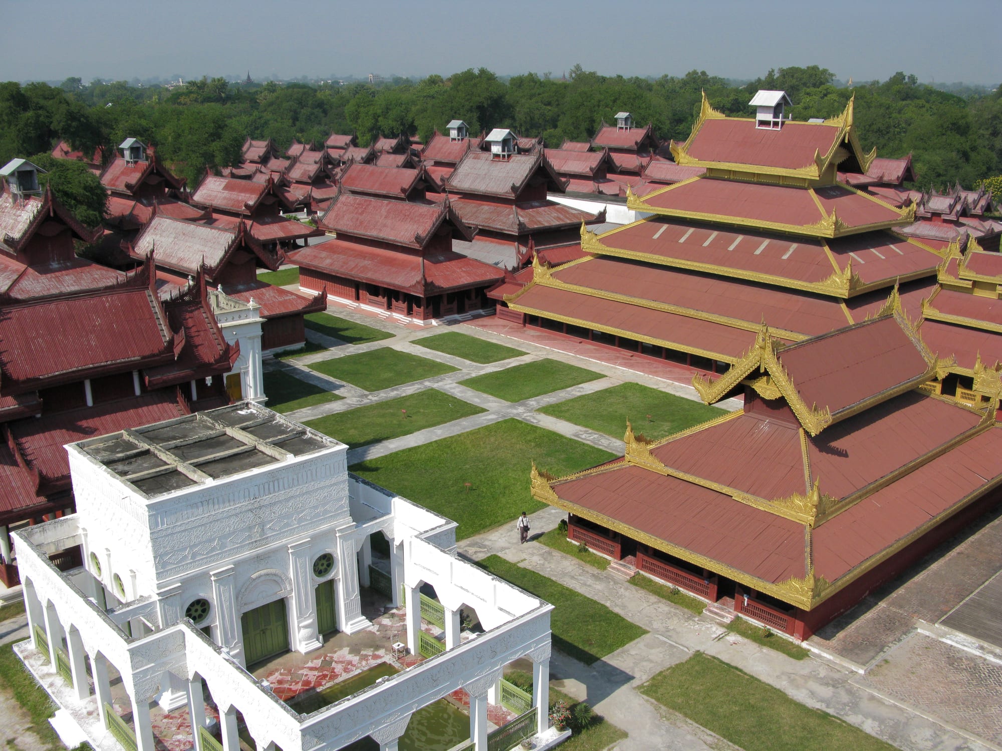 The tiered golden spire and red wooden halls of the reconstructed Mandalay Palace