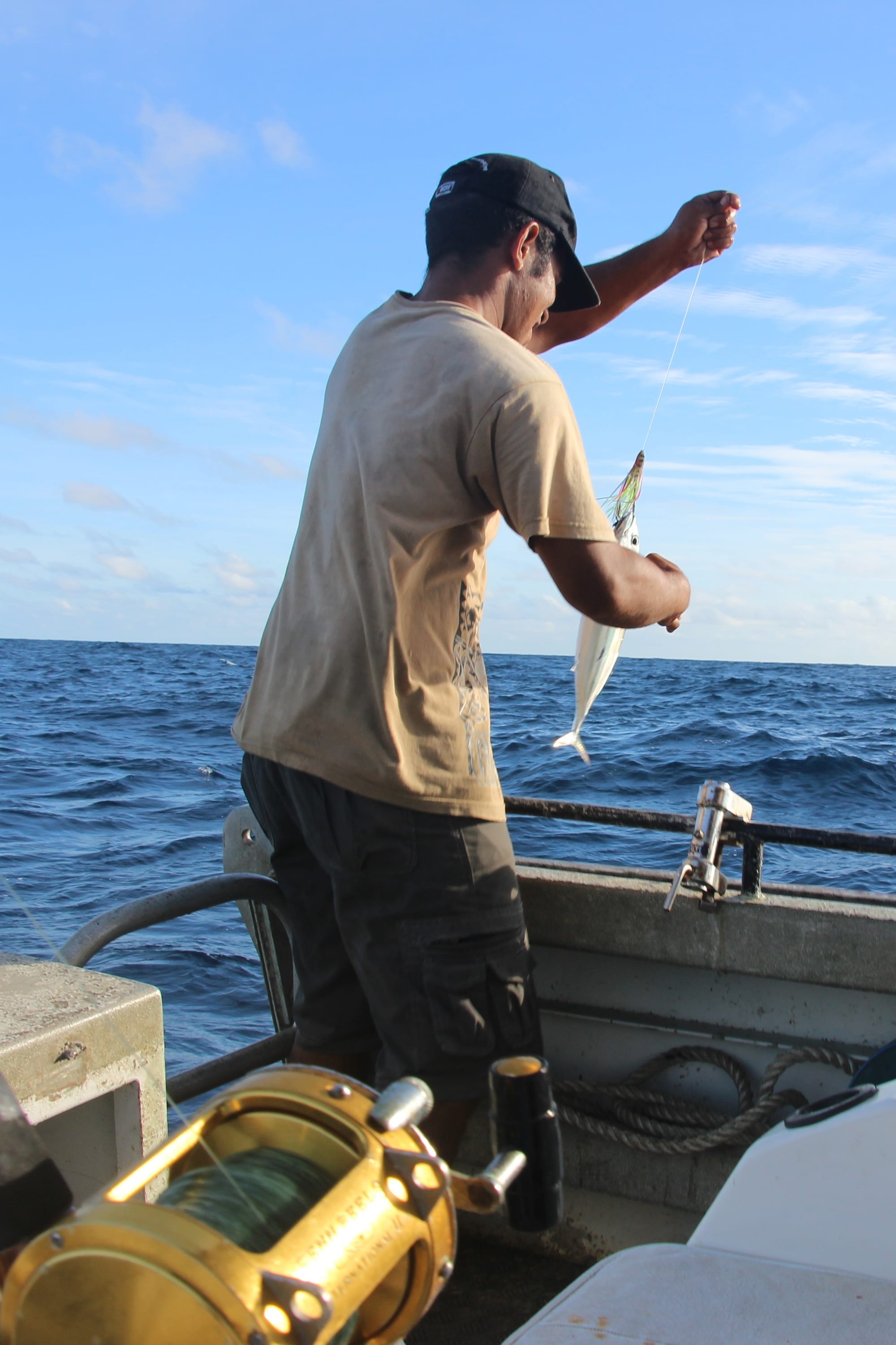 A Nauruan fisherman hauling in a fish catch