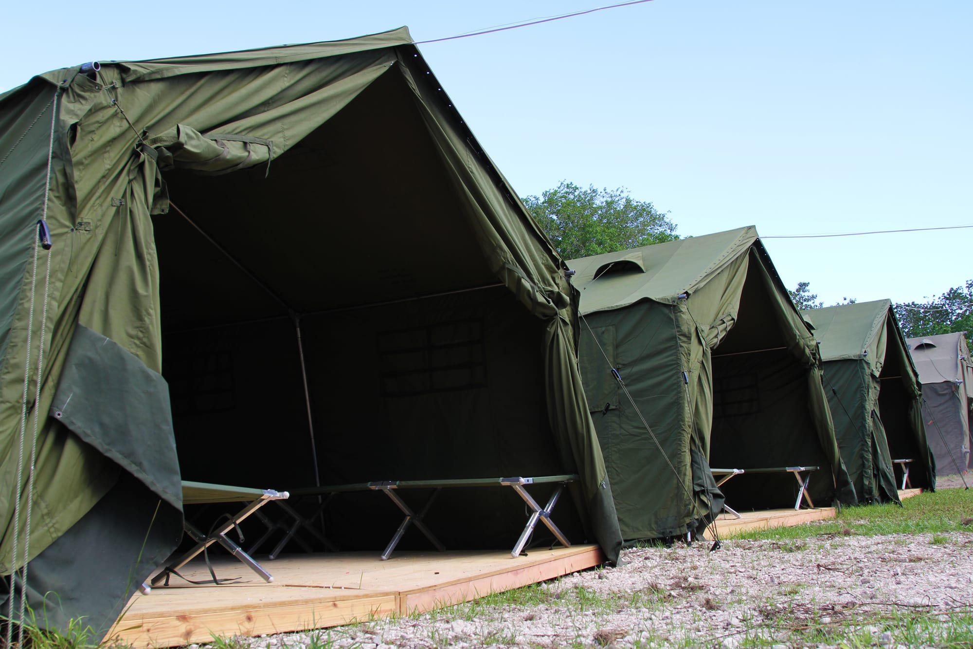 Rows of white tents and demountable buildings behind fencing at the Nauru detention centre