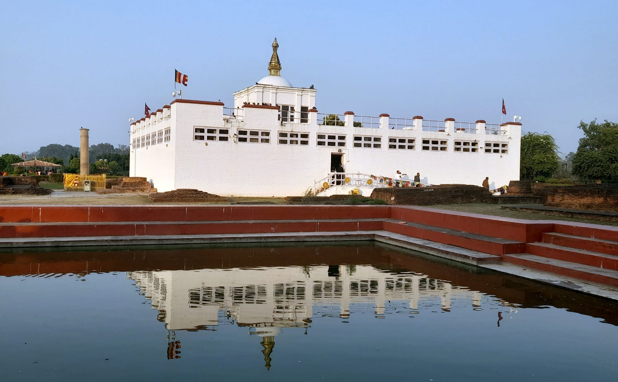 The white Maya Devi Temple and a sacred pool at Lumbini, the Buddha's birthplace