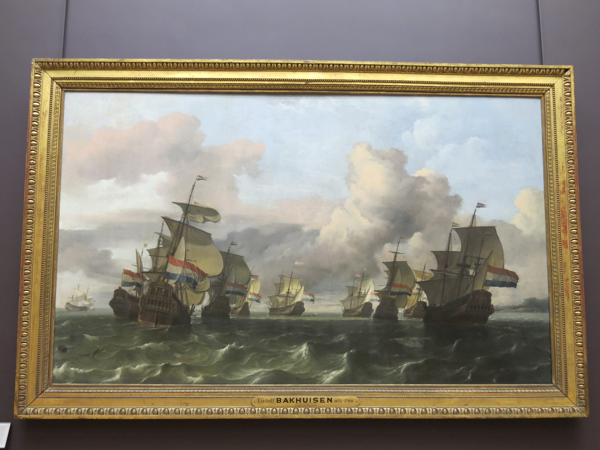 A 17th-century painting of a crowded harbour full of Dutch merchant sailing ships