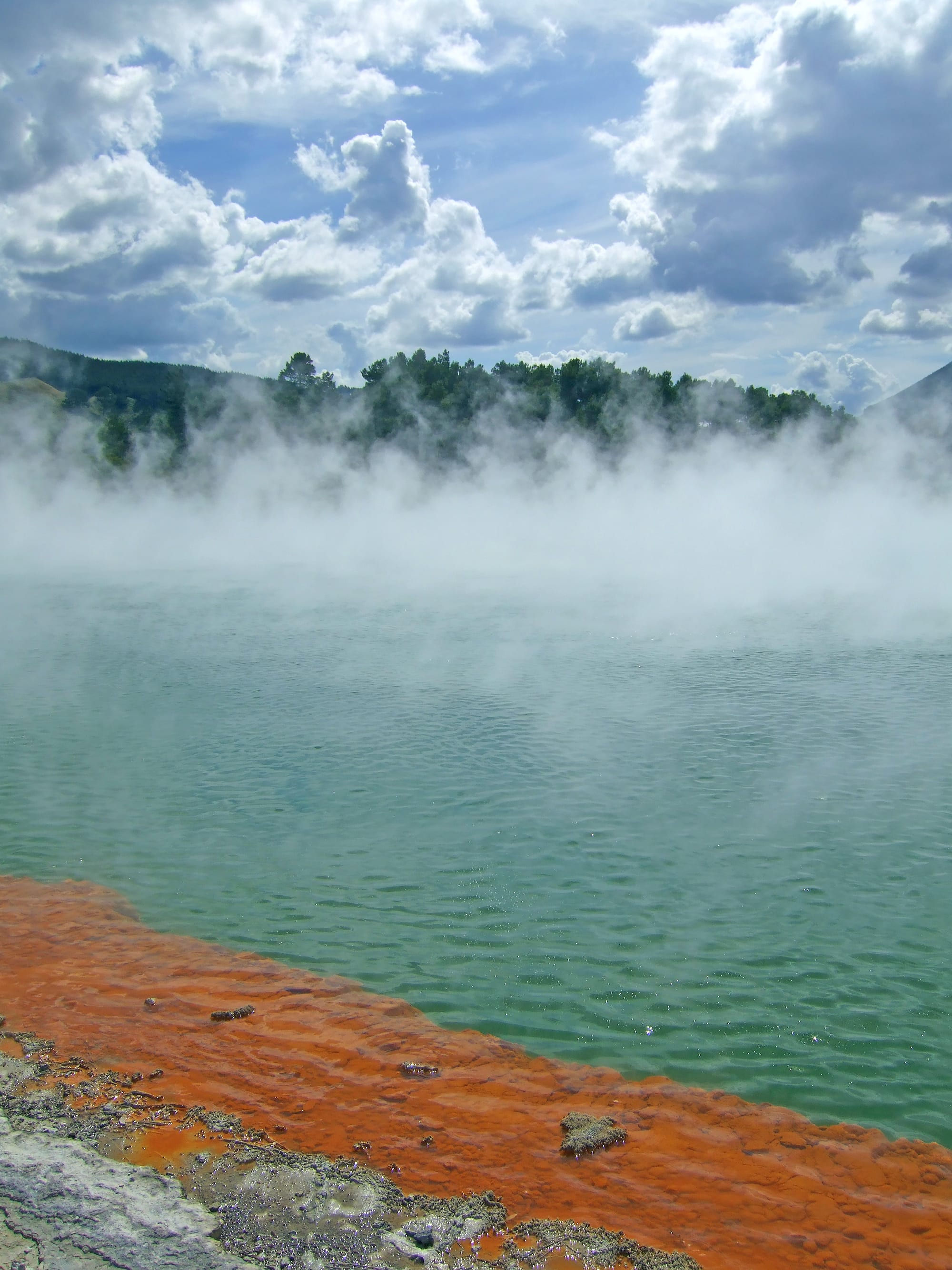 Steaming, mineral-coloured geothermal pools and terraces