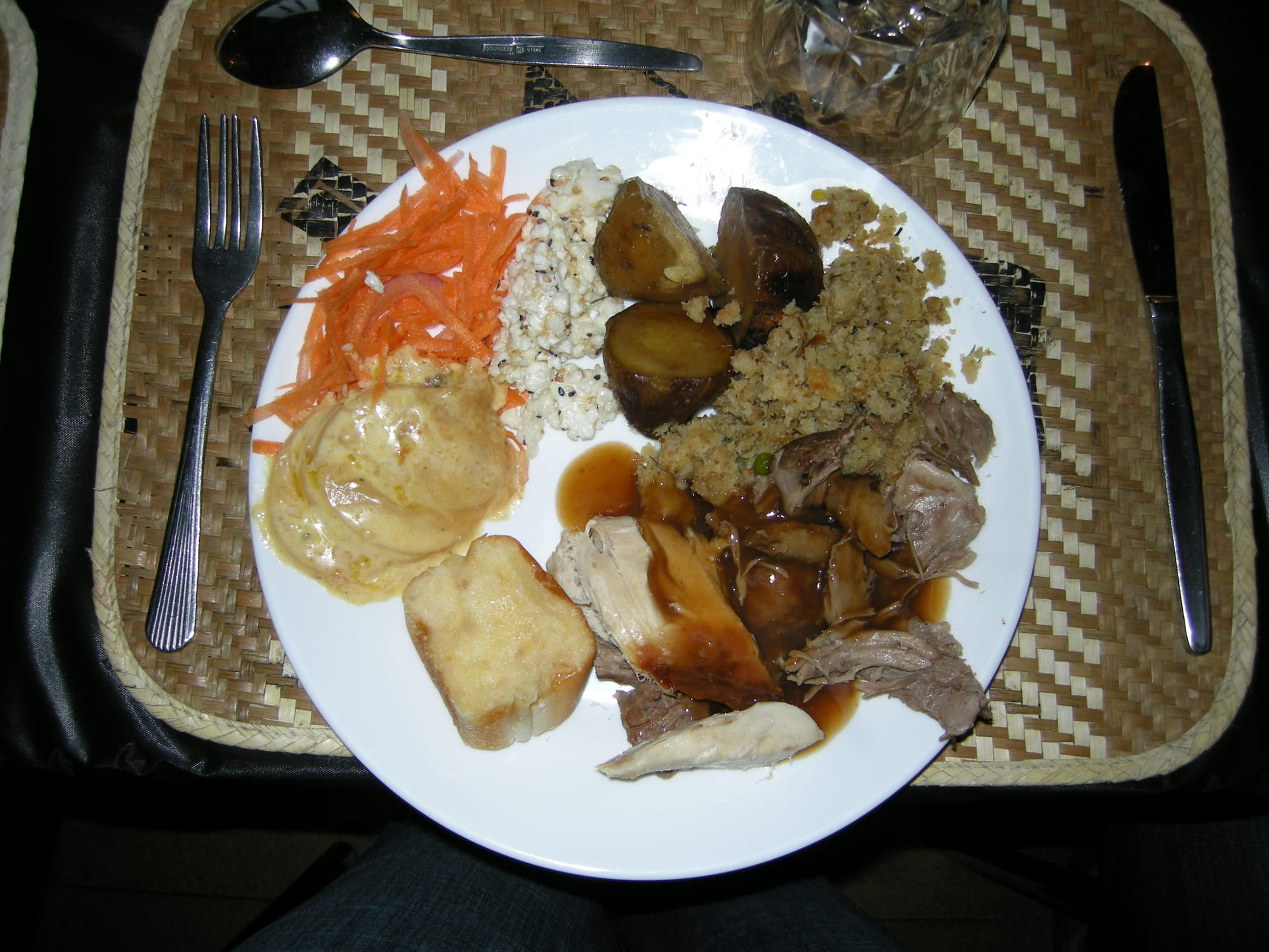 A plate of meat and root vegetables cooked in an earth oven