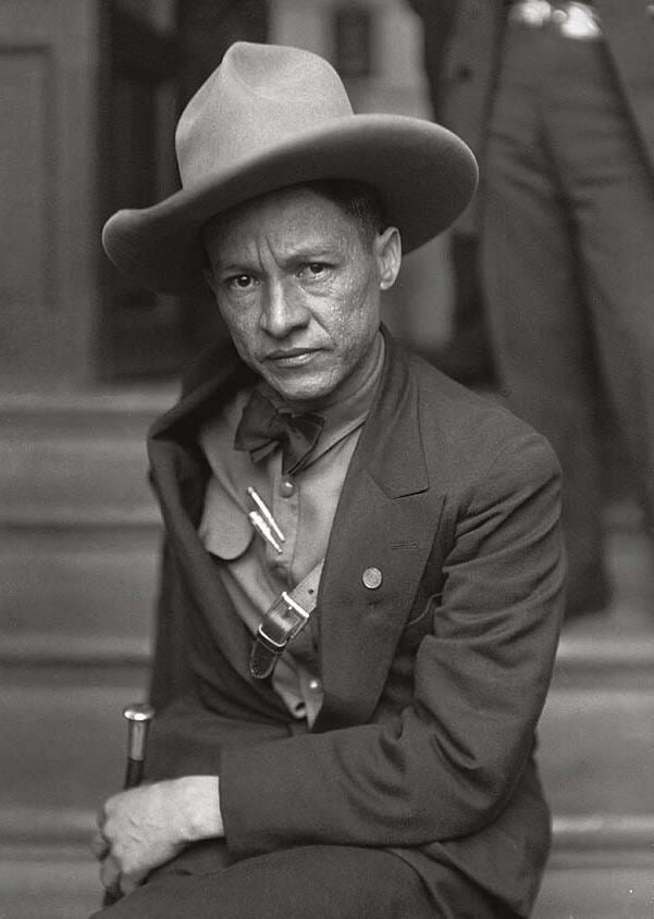 A formal photographic portrait of Augusto César Sandino in a broad-brimmed hat