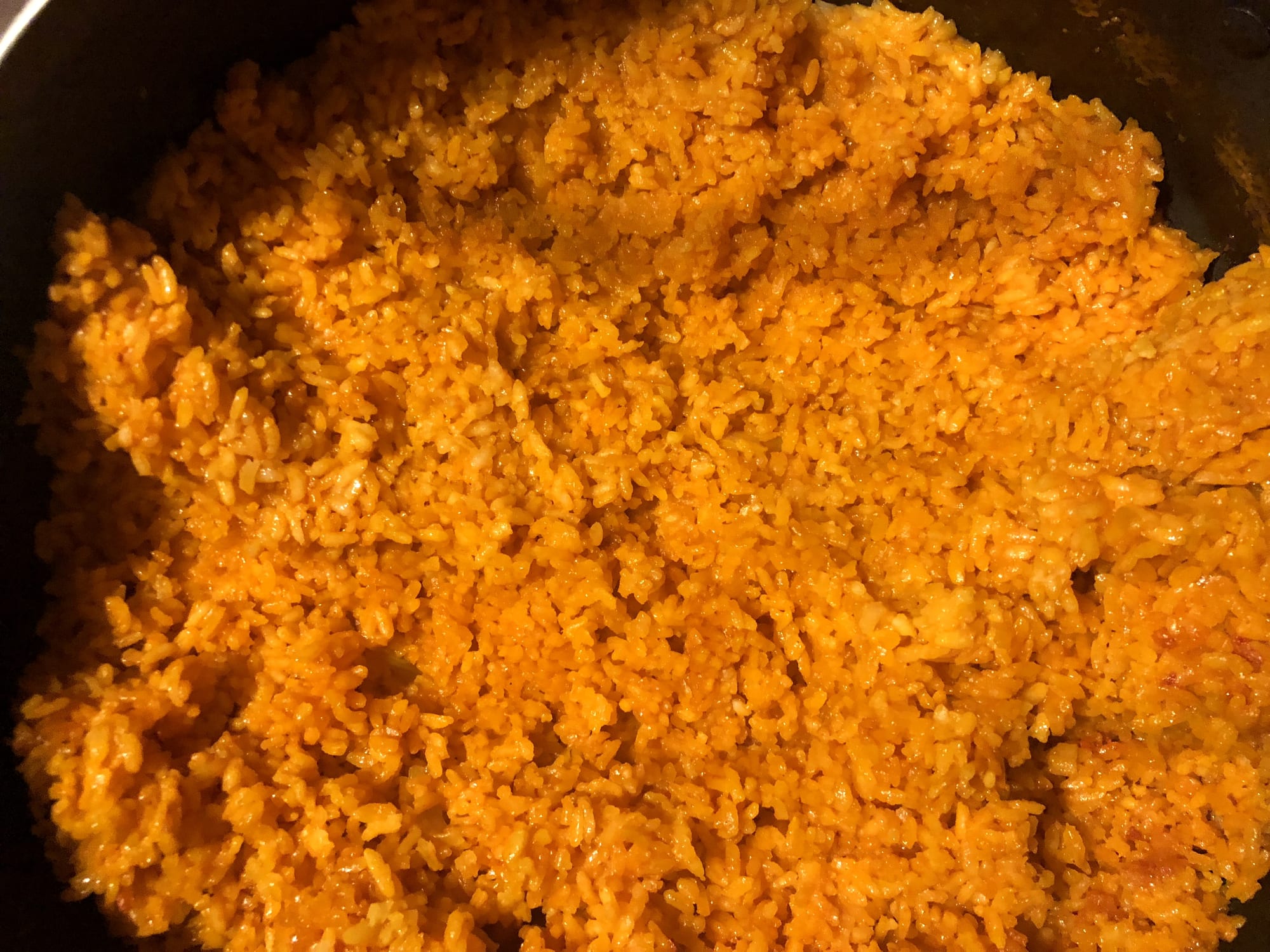 A pan of red rice, coloured with achote seed