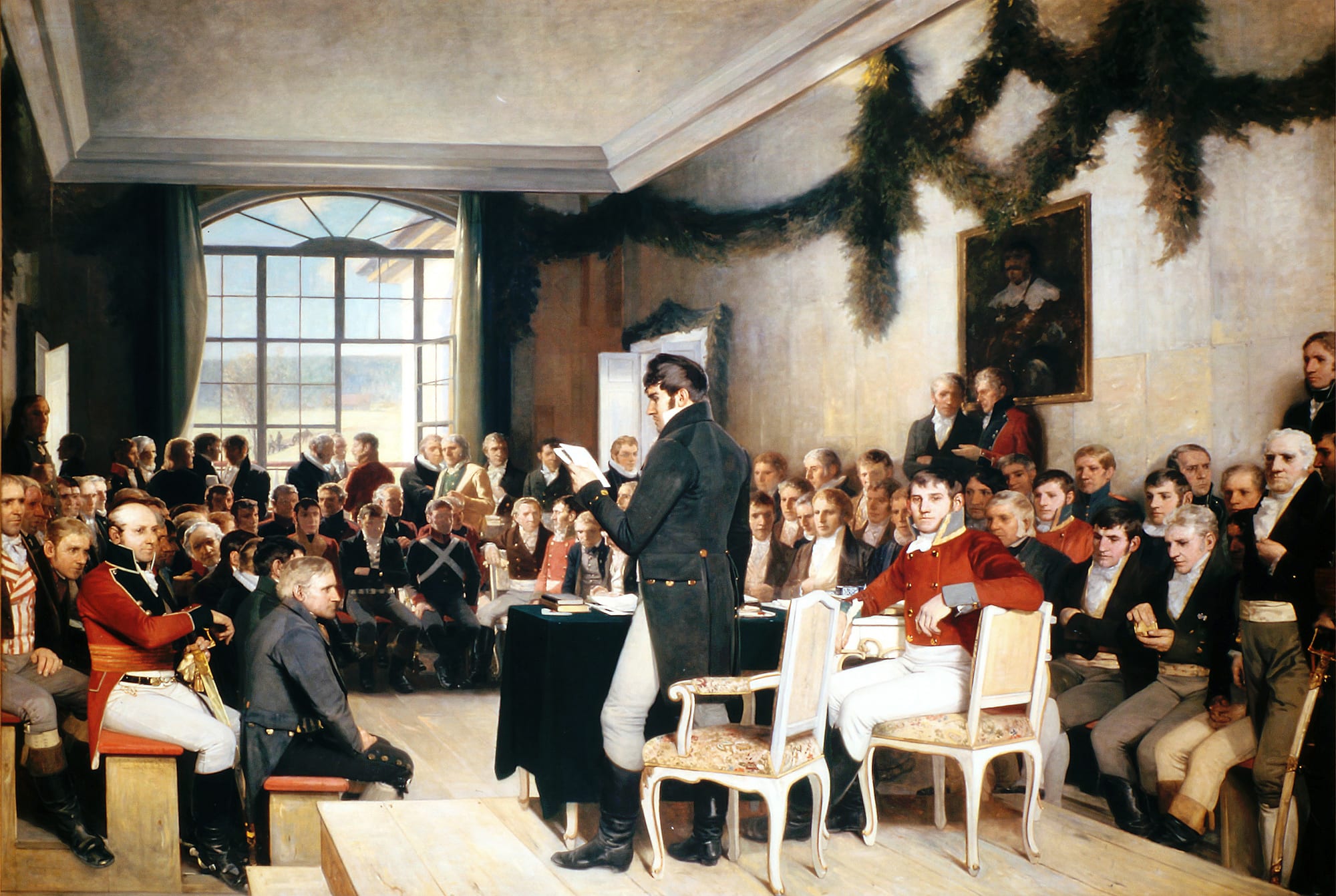 A large historical painting of delegates in early-19th-century dress debating in a hall at Eidsvoll in 1814
