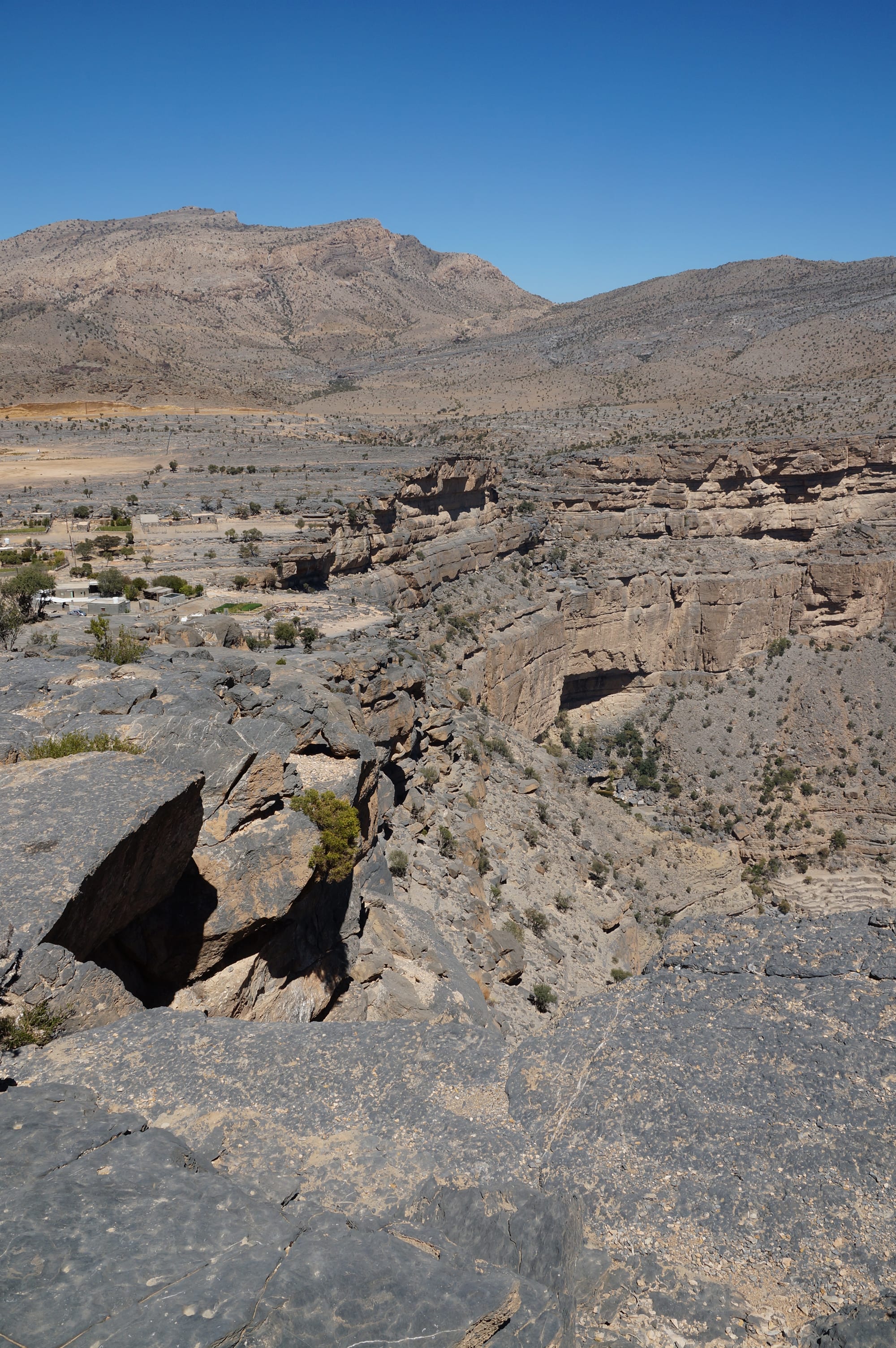 A vast, deep rocky canyon with sheer cliff walls