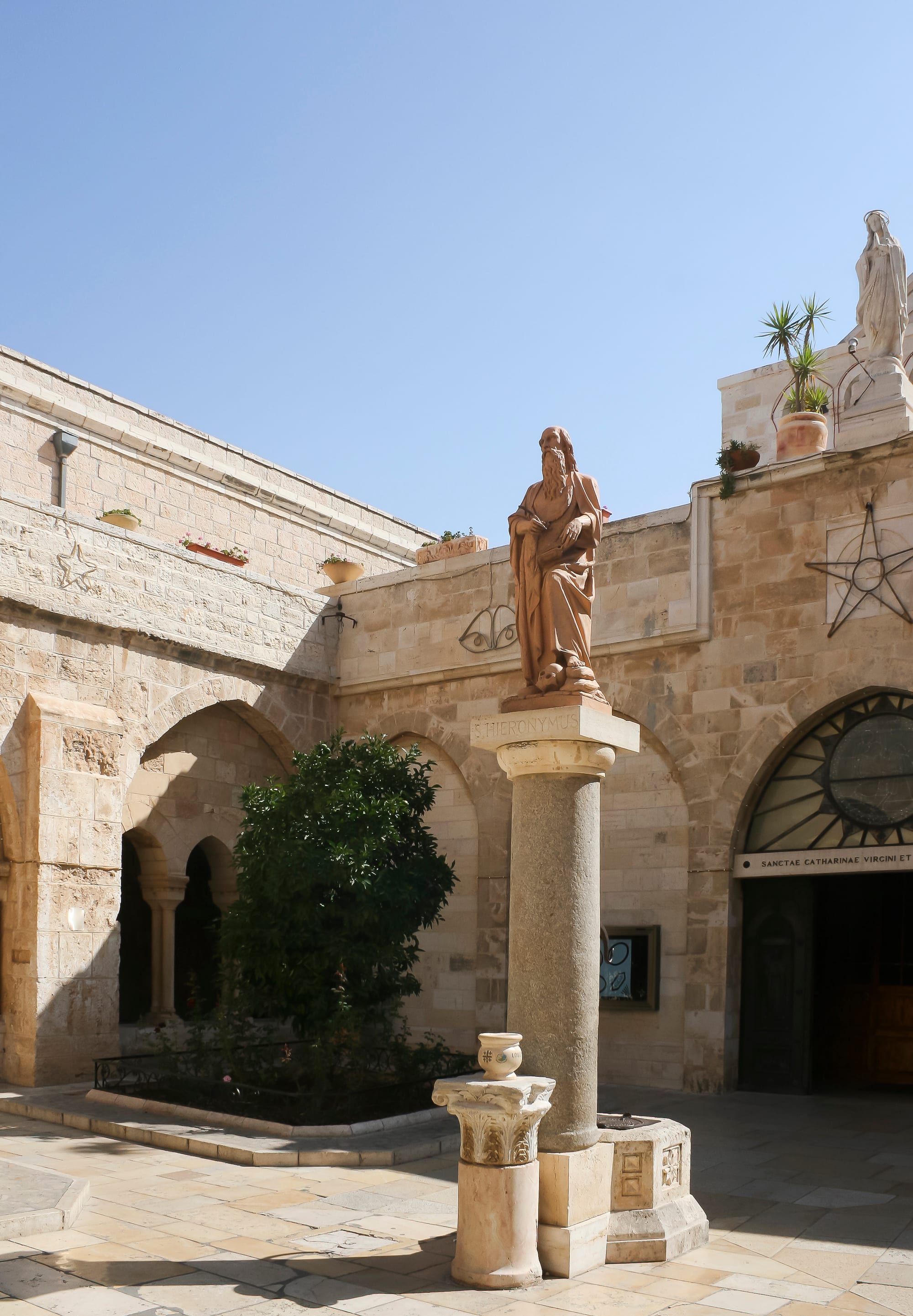 The interior of an ornate stone church with arched columns