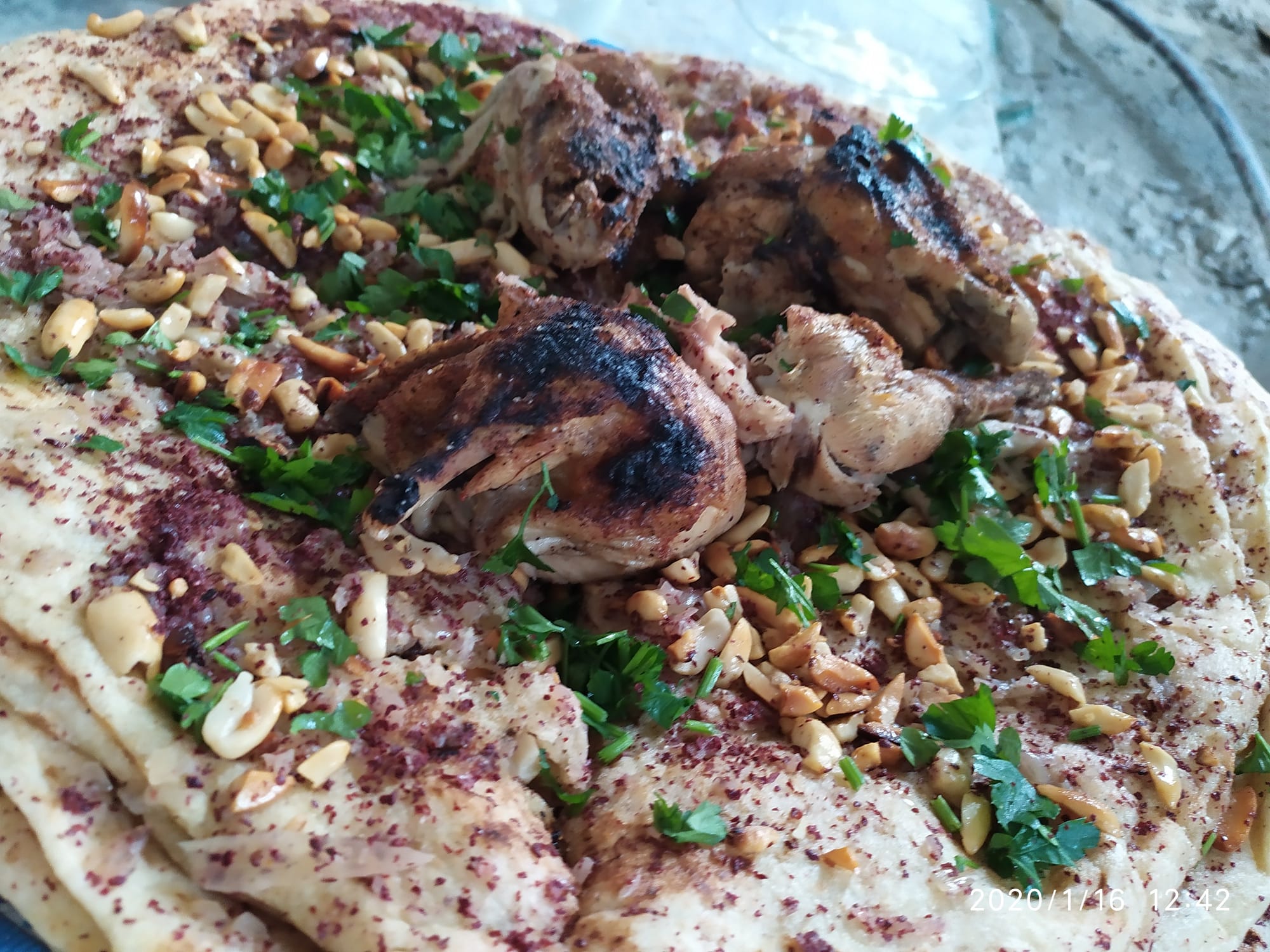 Roasted chicken with caramelised onions served on flatbread