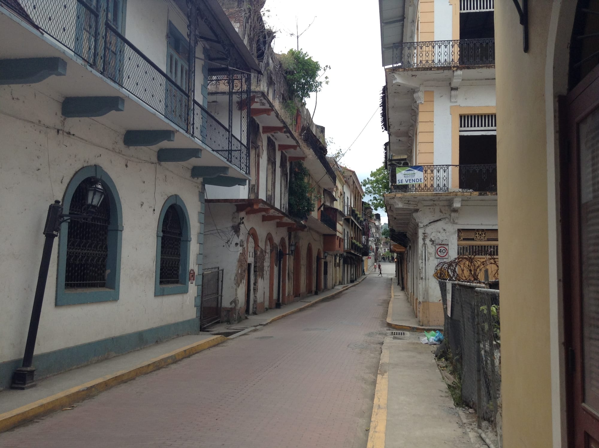 A quiet street of old colonial buildings with iron balconies in Casco Viejo, Panama City