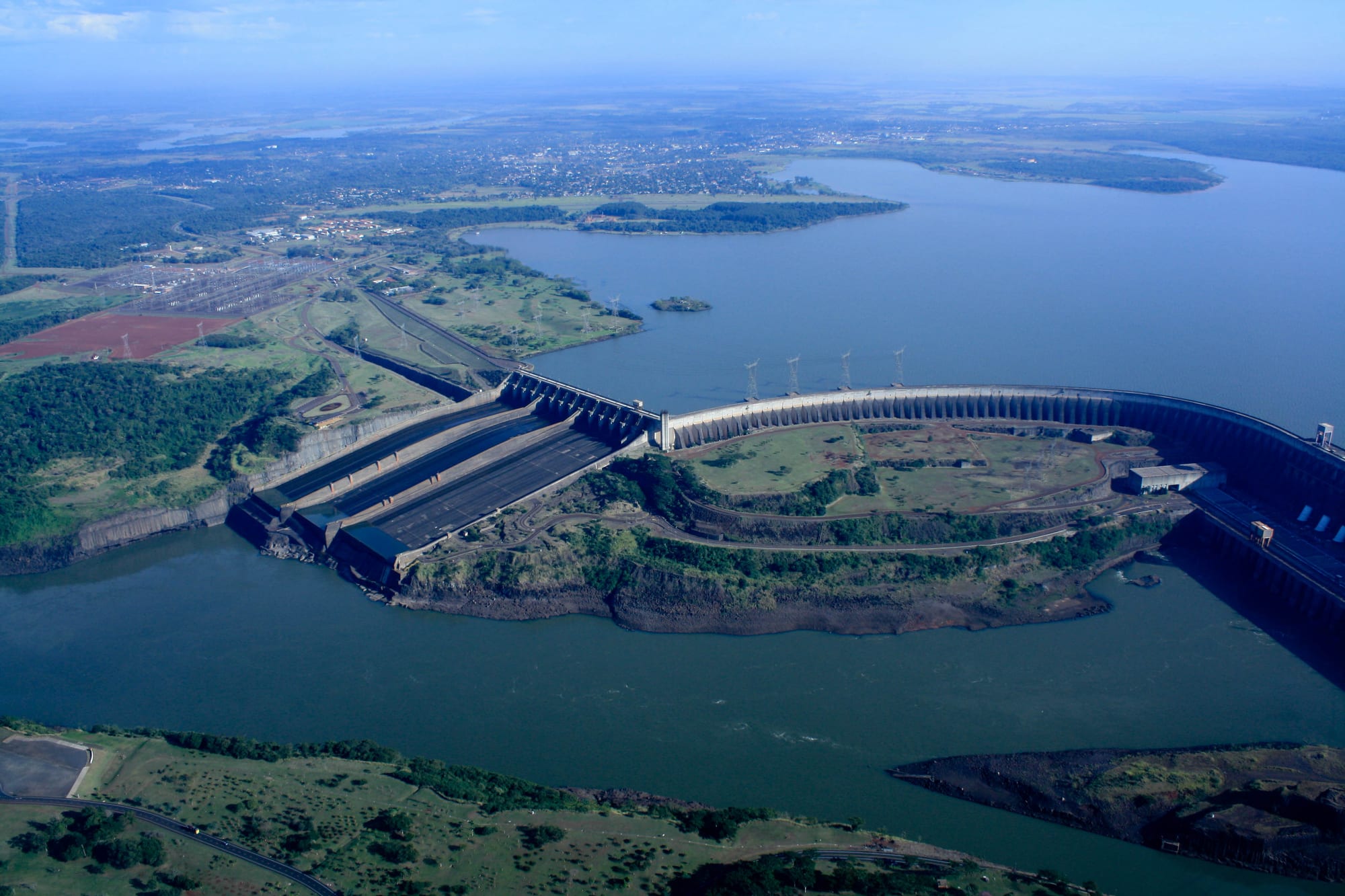 A massive concrete dam spanning a wide river
