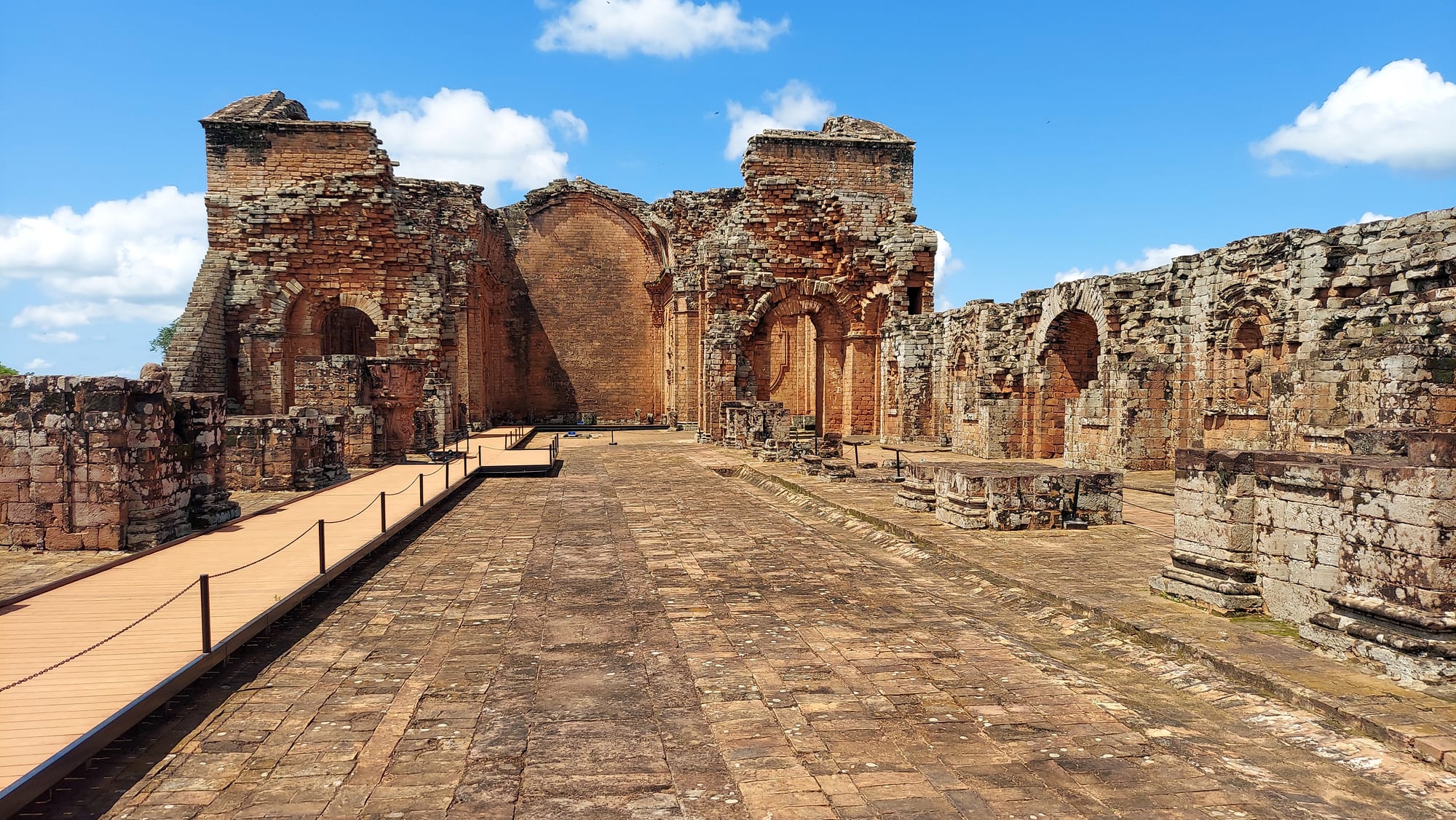 A partially ruined stone church facade with ornate carved details