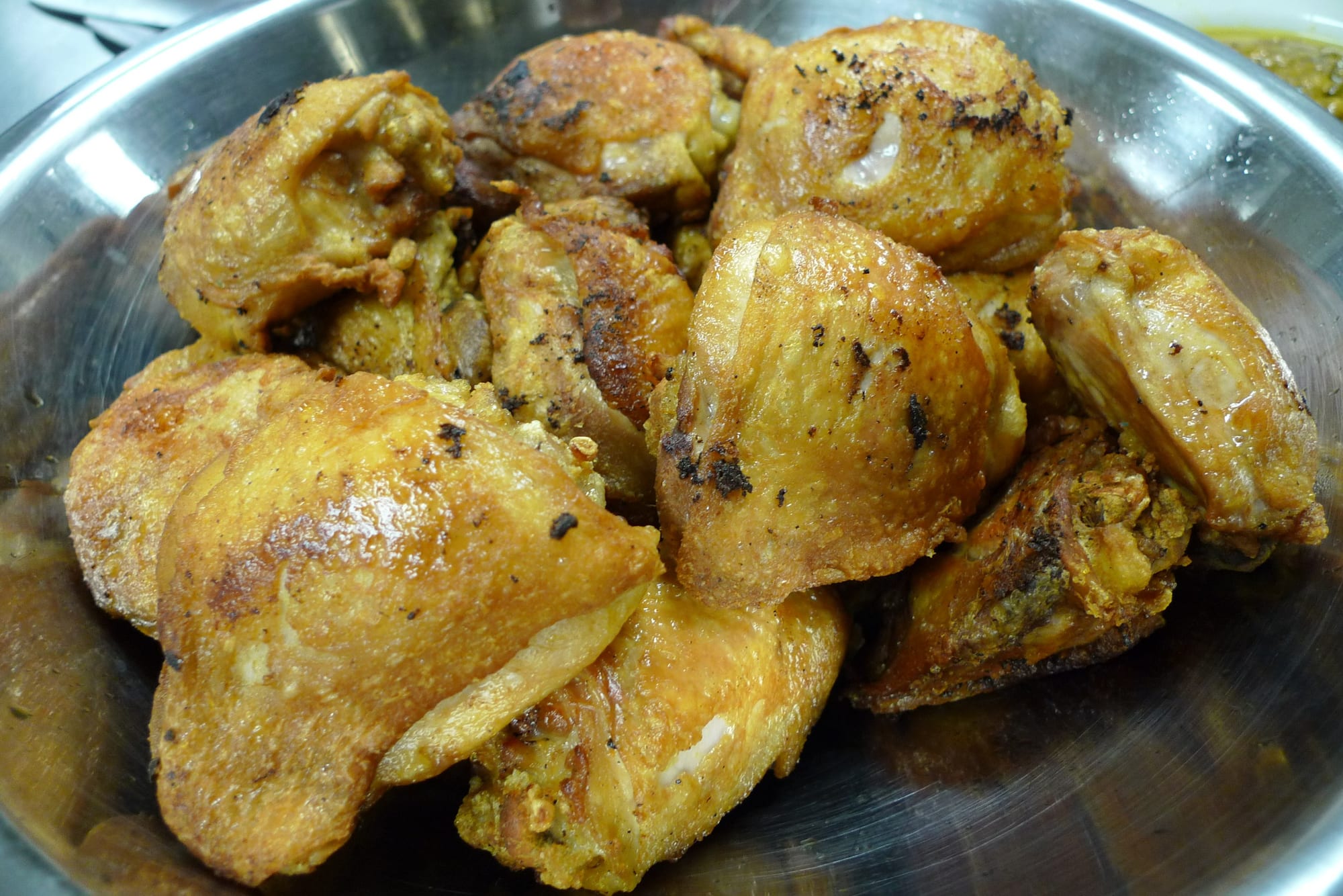 A plate of chicken braised in a dark vinegar and soy sauce