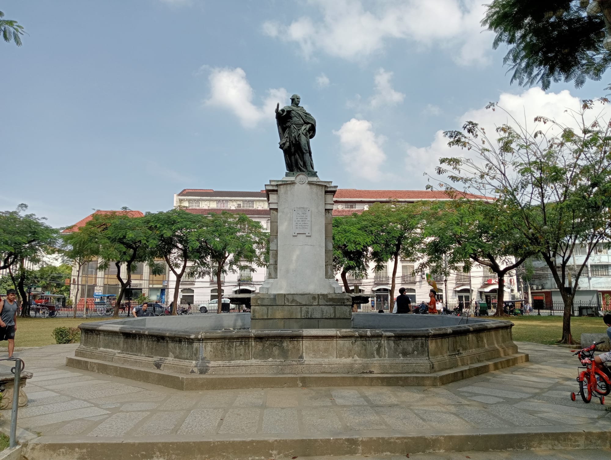 A plaza with a fountain inside the old walled city of Intramuros, Manila, with the cathedral behind
