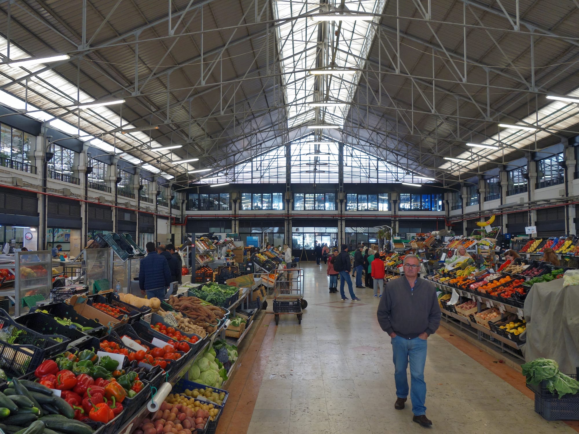The interior of a large indoor market hall