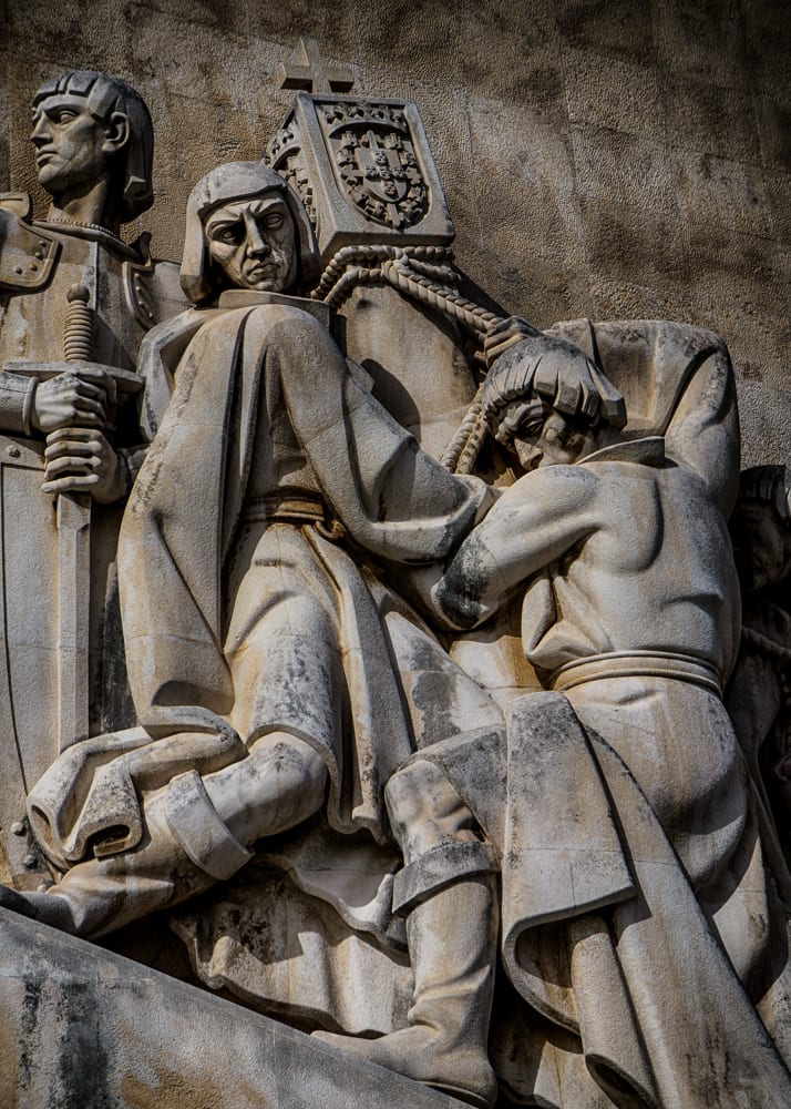 The Monument to the Discoveries in Lisbon, shaped like a caravel prow crowded with carved historical figures