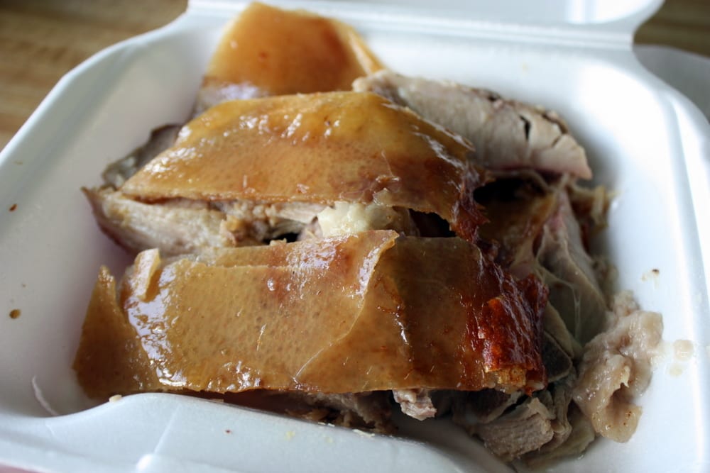 A whole roasted pig on a spit