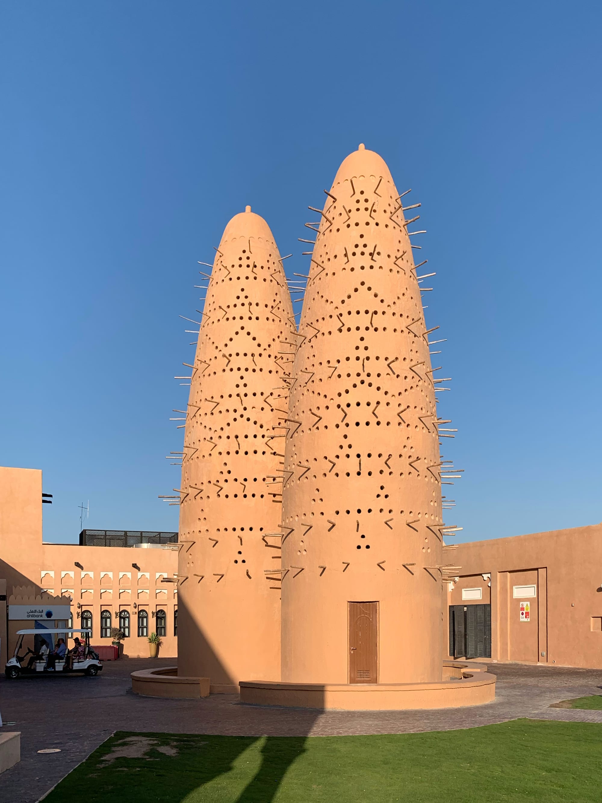 Traditional-style dovecote towers within a cultural village complex