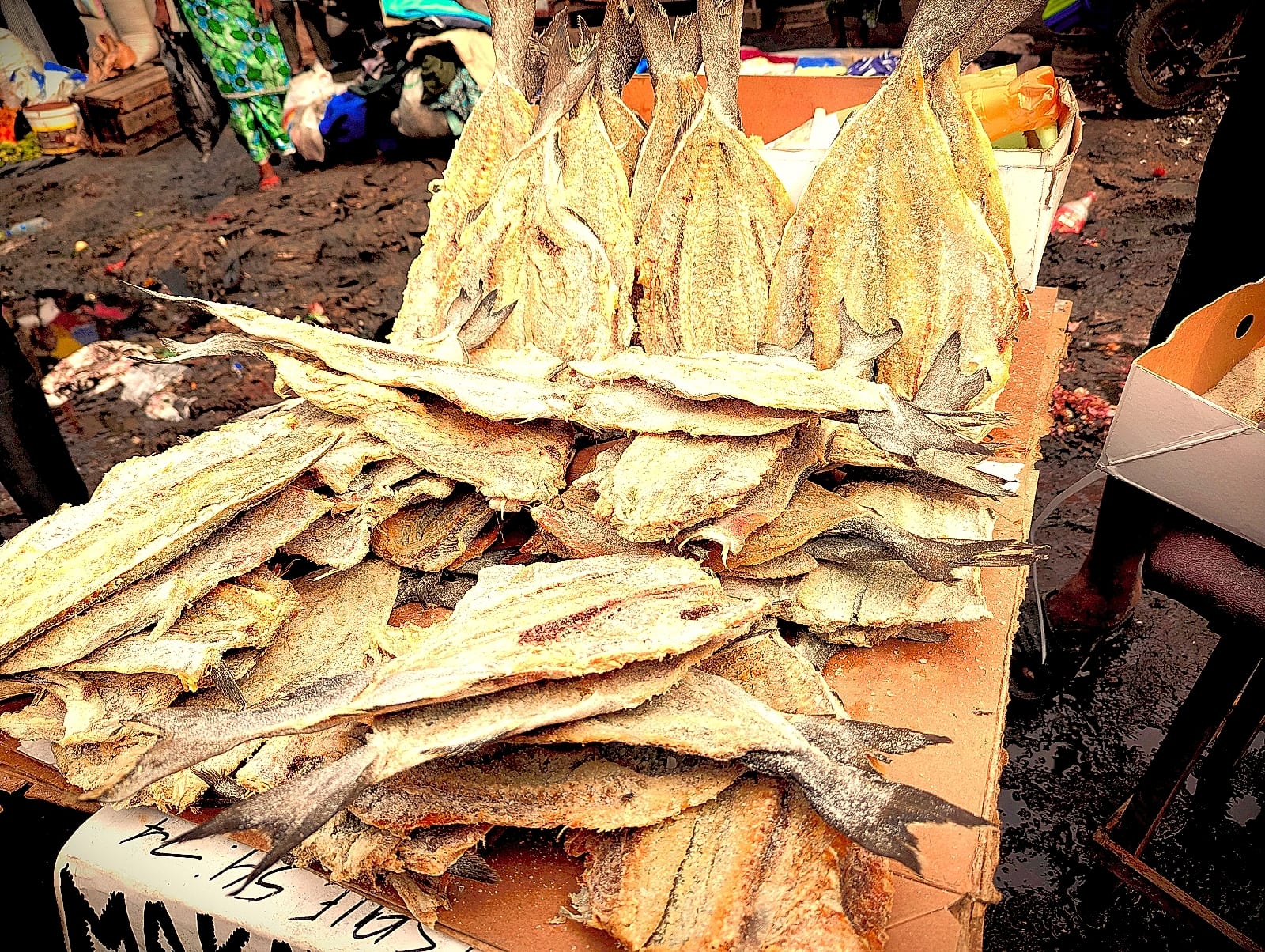 Salted fish displayed for sale on a market table