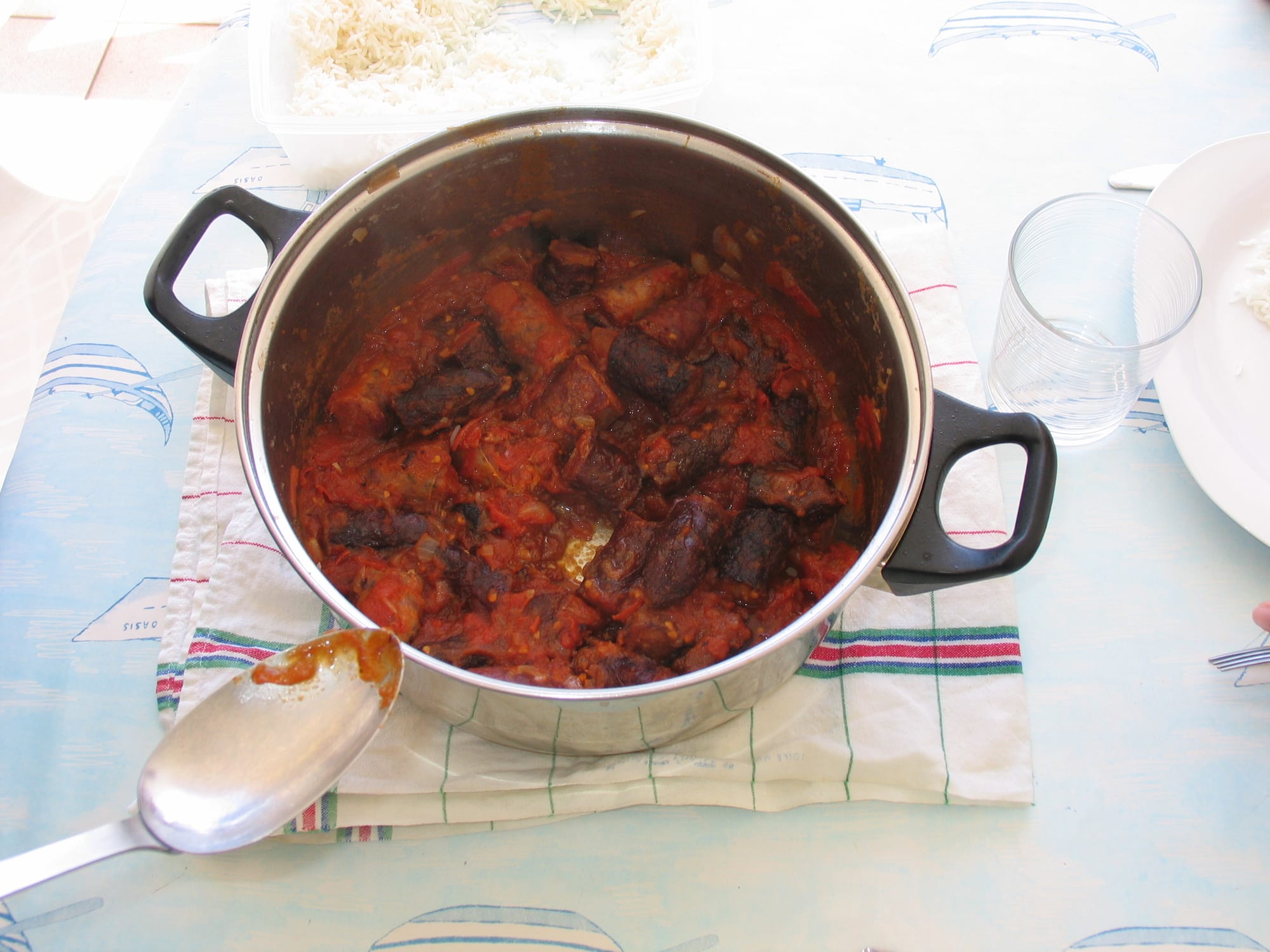 A dish of sausage in a tomato-based sauce