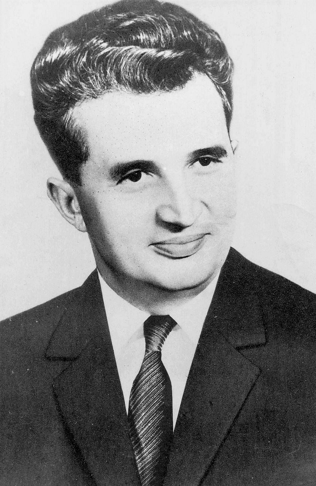 An official portrait of Nicolae Ceaușescu in a dark suit