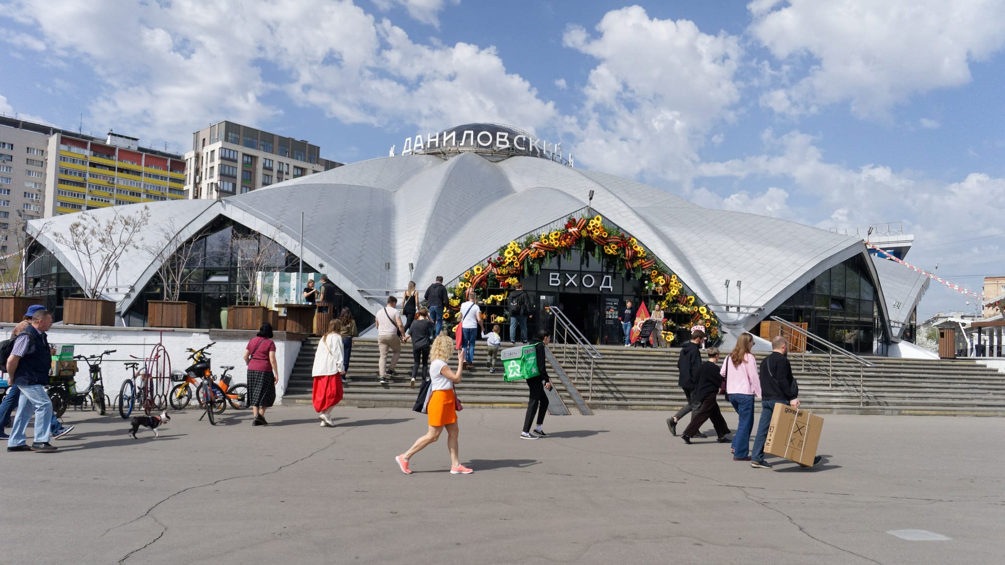 An indoor food market with produce stalls