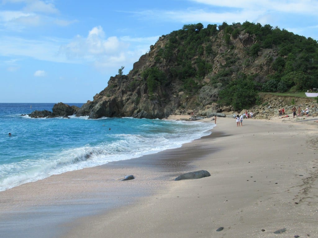 A beach covered in pale shell fragments instead of ordinary sand