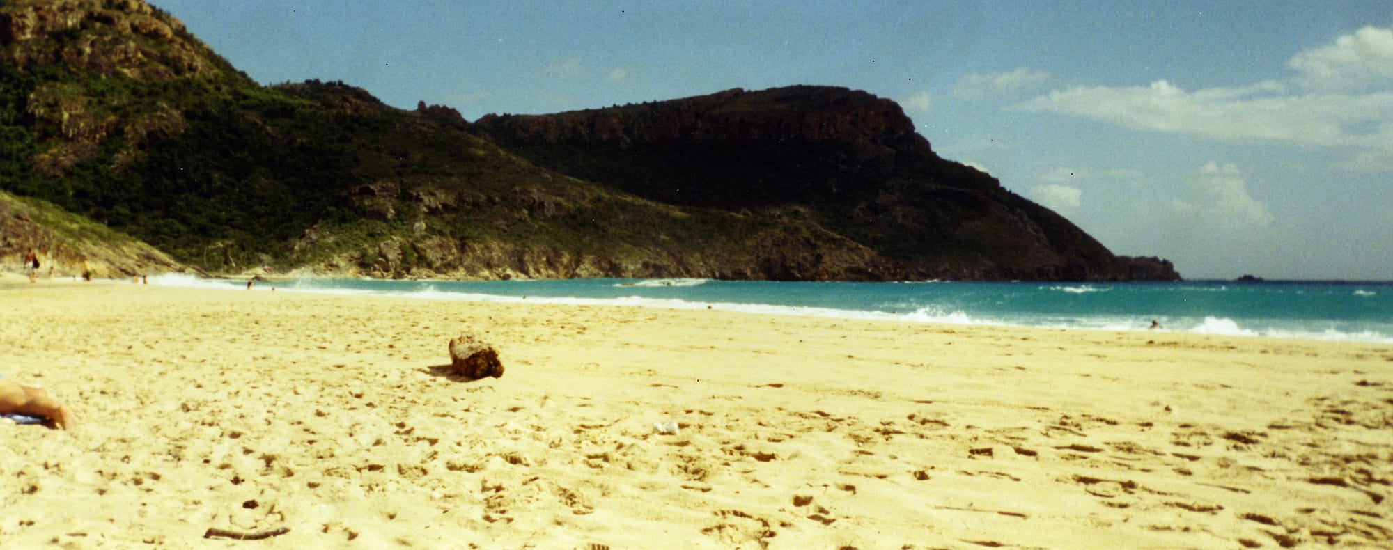 An empty white-sand beach backed by scrub and low hills at Anse de Grande Saline on Saint Barthélemy